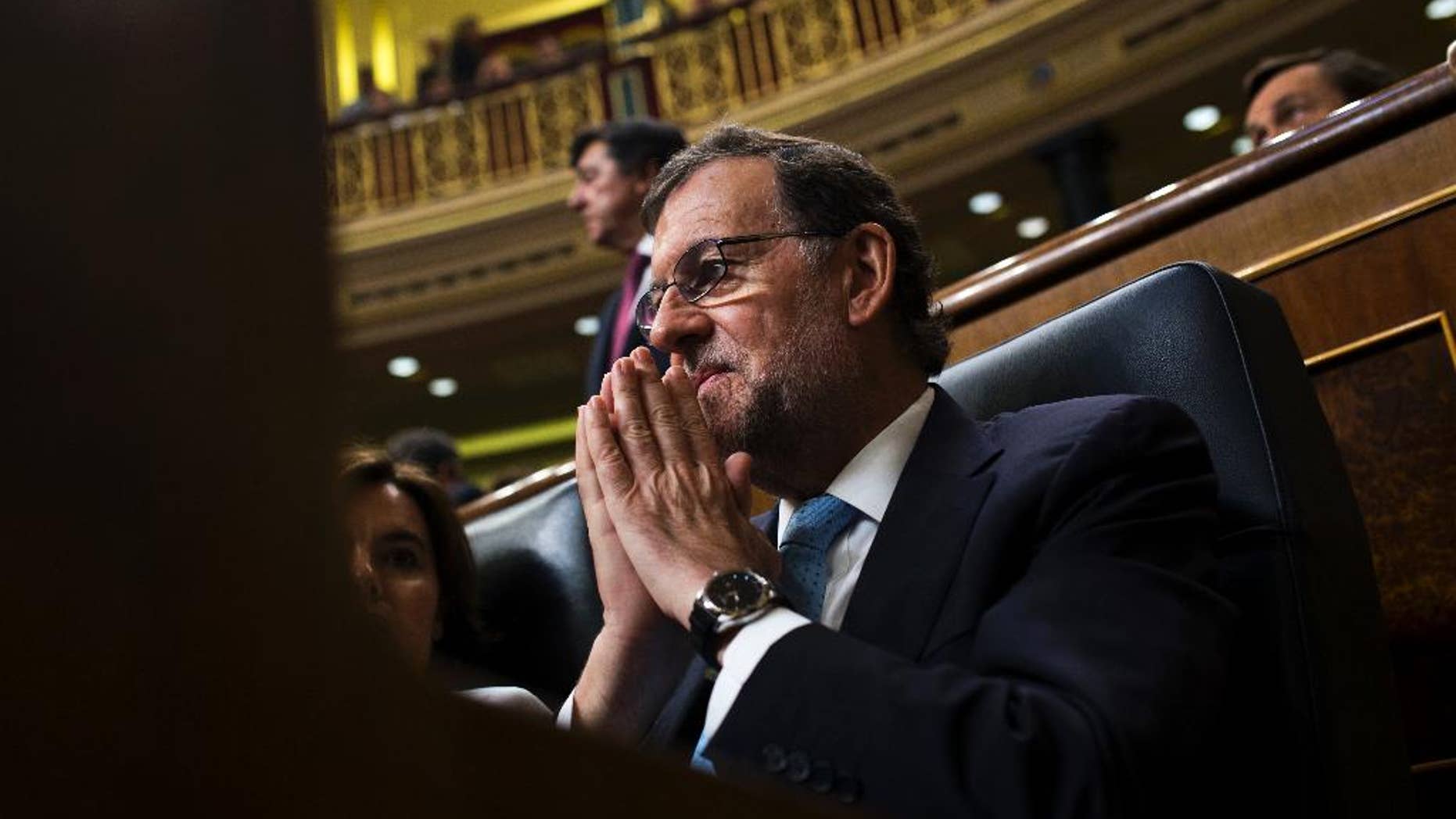 FILE - In this July 19, 2016 file photo, Spain's acting Prime Minister Mariano Rajoy attends the Spanish parliament in Madrid. Spain's acting Prime Minister Mariano Rajoy warned on Saturday Aug. 13, 2016 that a third round of elections in one year would make Spain "the laughingstock of Europe" as he tries to cobble together support to form a government and end eight months of political deadlock. (AP Photo/Francisco Seco, FILE)