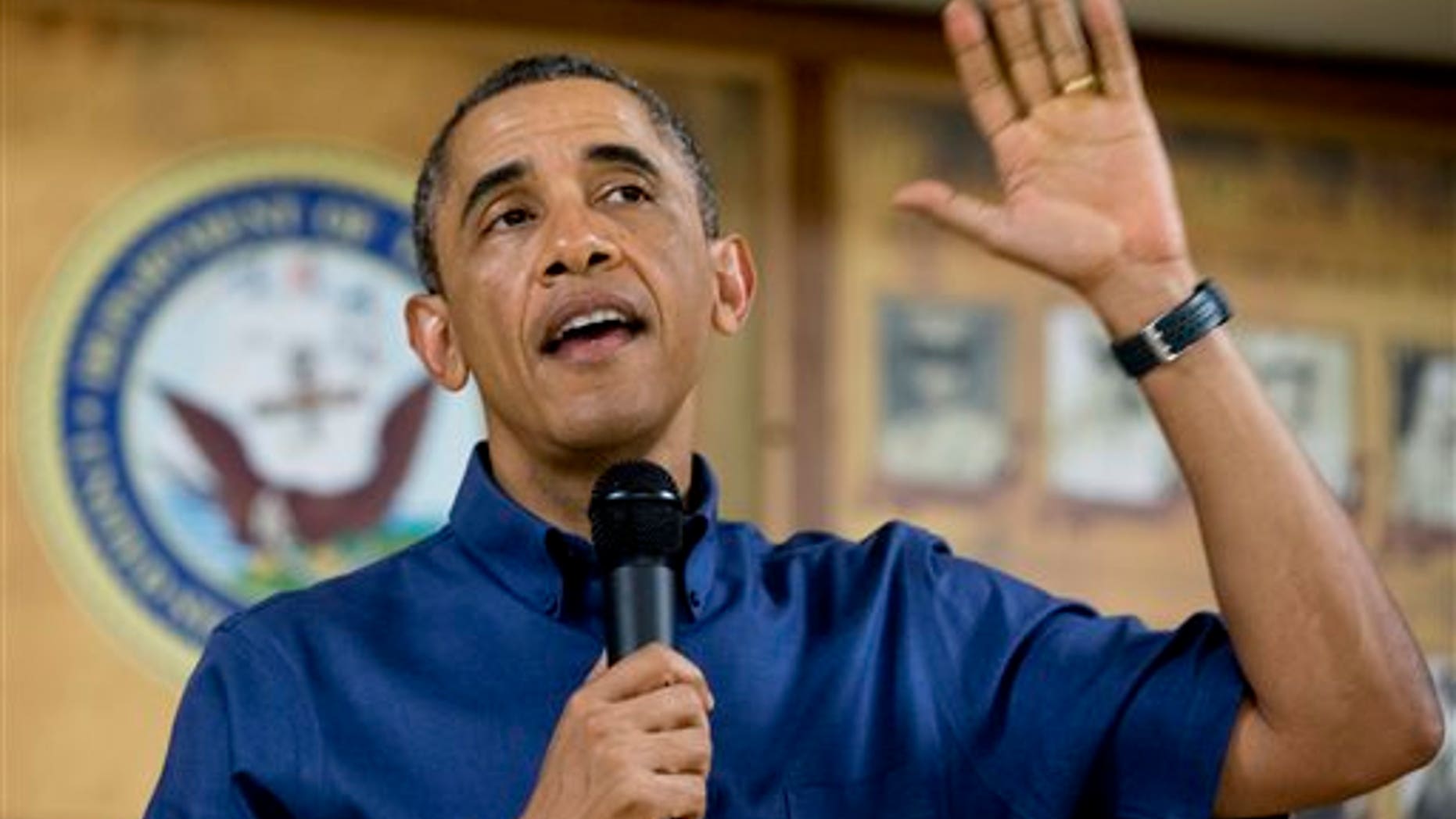President Barack Obama speaks to members of the military and their families in Anderson Hall at Marine Corps Base Hawaii, Wednesday, Dec. 25, 2013, in Kaneohe Bay, Hawaii. The first family is in Hawaii for their annual holiday vacation. (AP Photo/Carolyn Kaster)