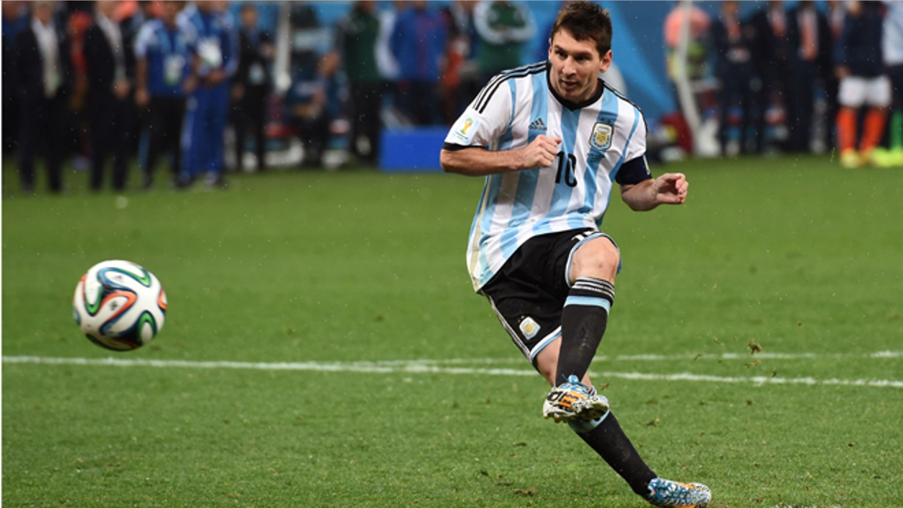 SAO PAULO, BRAZIL - JULY 09: Lionel Messi of Argentina shoots and scores his penalty kick in a shootout during the 2014 FIFA World Cup Brazil Semi Final match between the Netherlands and Argentina at Arena de Sao Paulo on July 9, 2014 in Sao Paulo, Brazil. (Photo by Matthias Hangst/Getty Images)