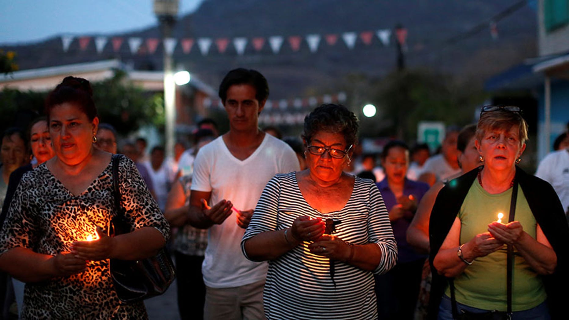 Mothers of missing sons come out of a service of Pedro Alberto Huesca, whose remains were found at one of the unmarked graves in Palmas de Abajo, Veracruz, Mexico on March 16, 2017.