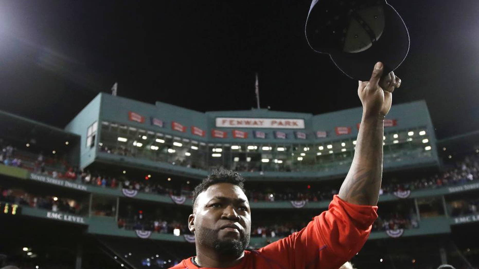 FILE- In this Oct. 10, 2016, file photo, Boston Red Sox designated hitter David Ortiz tips his cap after Game 3 of baseball's American League Division Series against the Cleveland Indians in Boston. Ortiz is set to speak at the New England Institute of Technology's 76th commencement at the Dunkin Donuts Center in Providence on Sunday, April 30, 2017. (AP Photo/Charles Krupa, File)