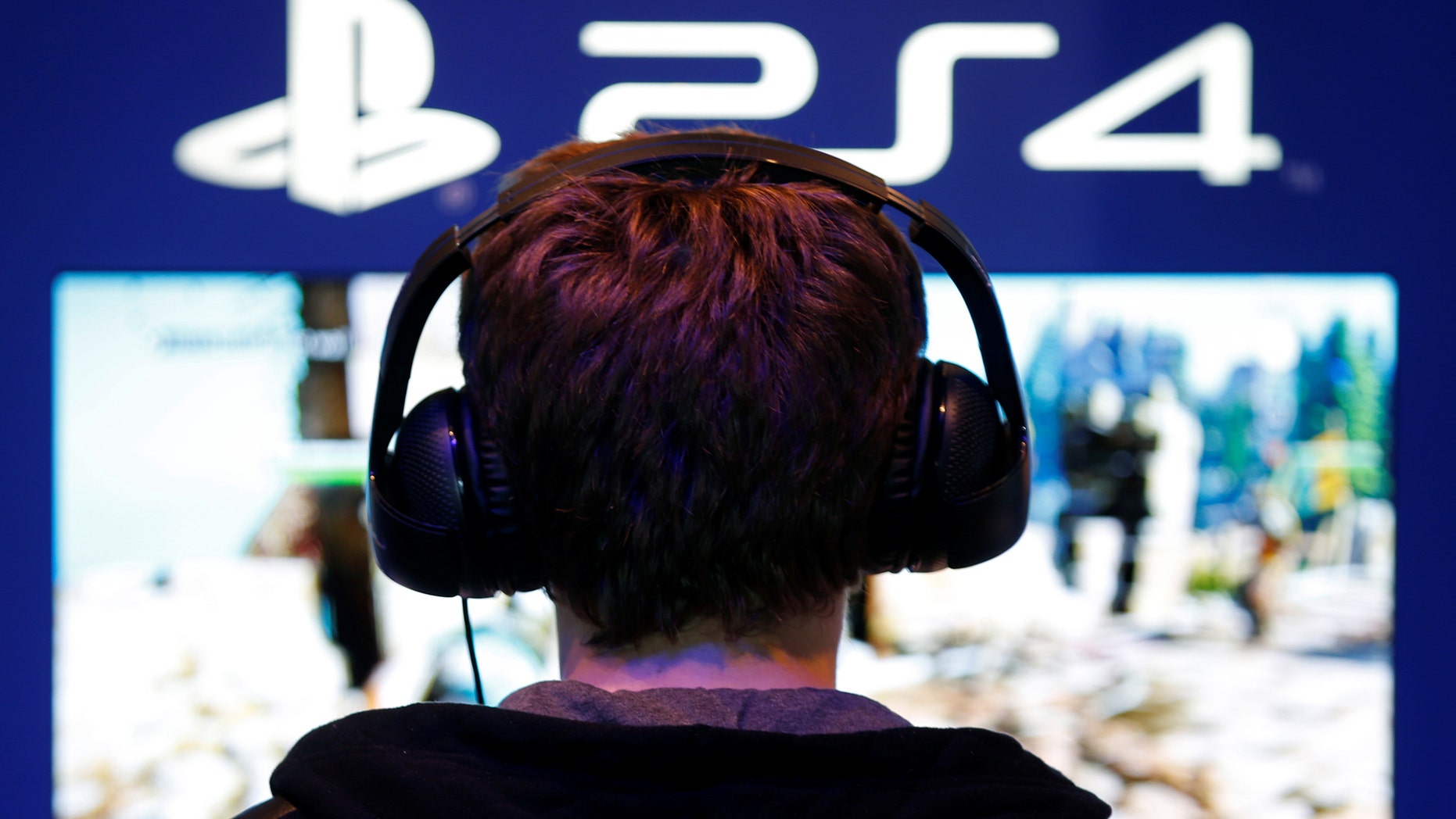 File photo: A visitors plays games on PlayStation 4 (PS4) at the Paris Games Week, a trade fair for video games in Paris, France, October 29, 2016. (REUTERS/Charles Platiau)