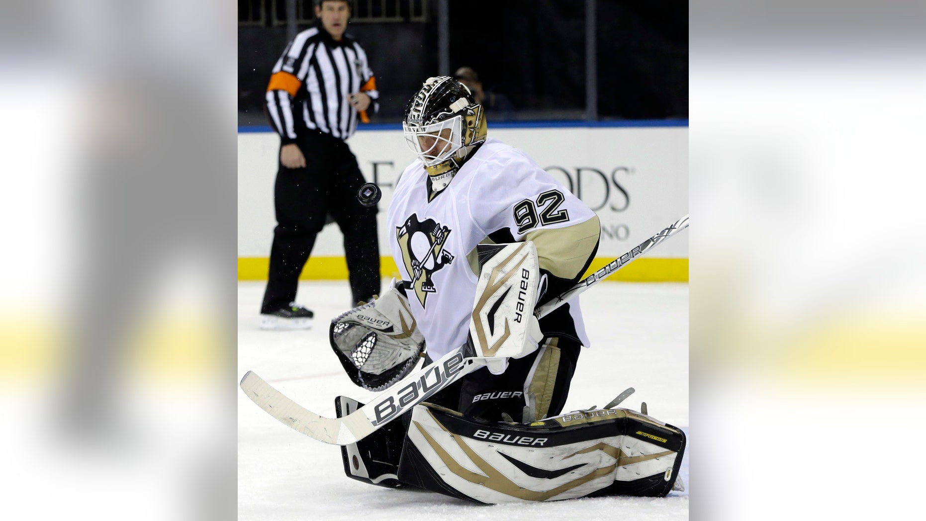 Pittsburgh Penguins goalie Tomas Vokoun (92), of Czech Republic, makes a save in the second period of their NHL hockey game against the New York Rangers in New York, Thursday, Jan. 31, 2013. The Penguins shutout the Rangers 3-0. (AP Photo/Kathy Willens