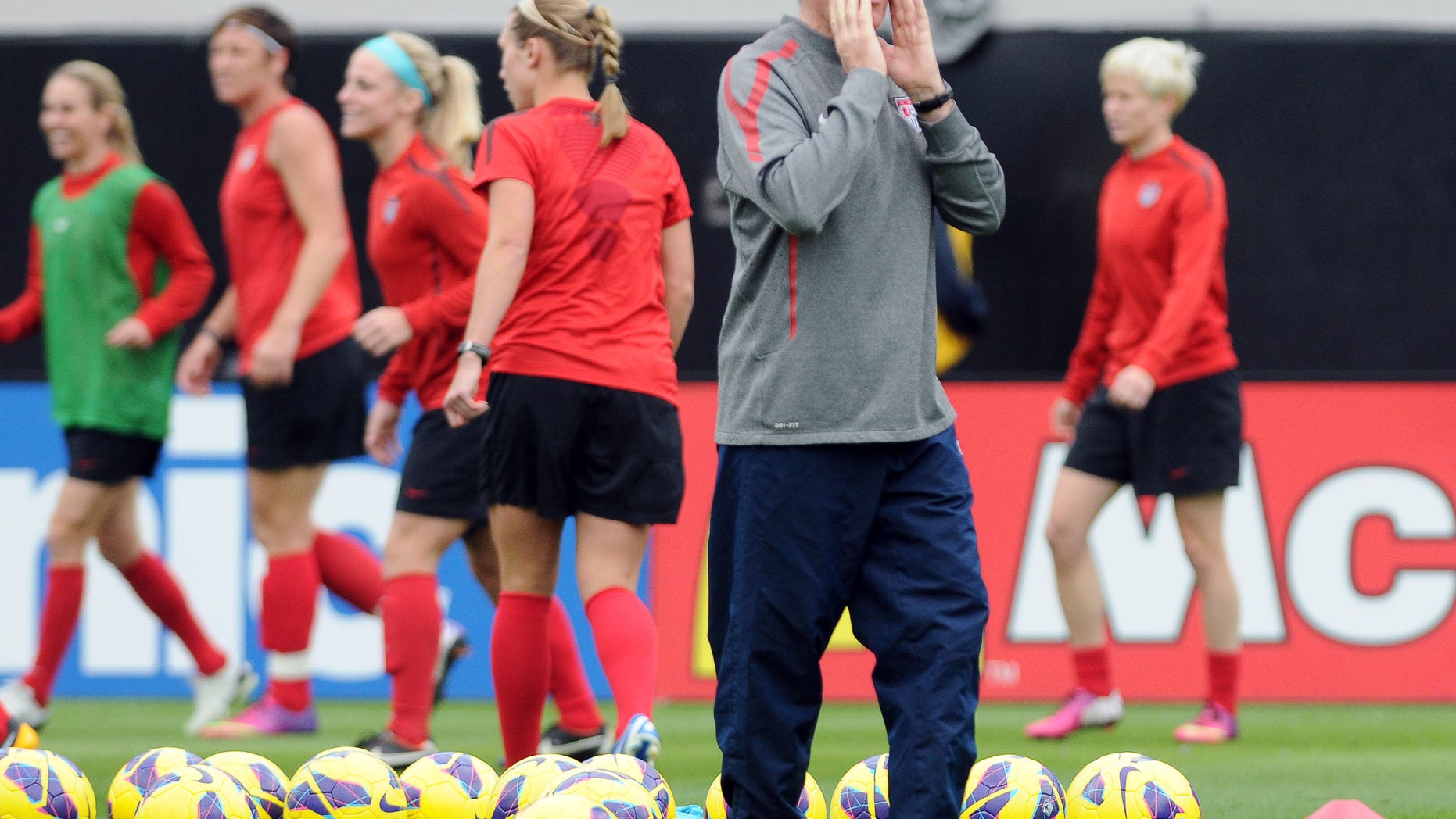 U.S. women's soccer team coach Tom Sermanni yells directions during practice in Jacksonville, Fla., on Friday, Feb. 8, 2013. (AP Photo/The Florida Times-Union, Bob Mack)