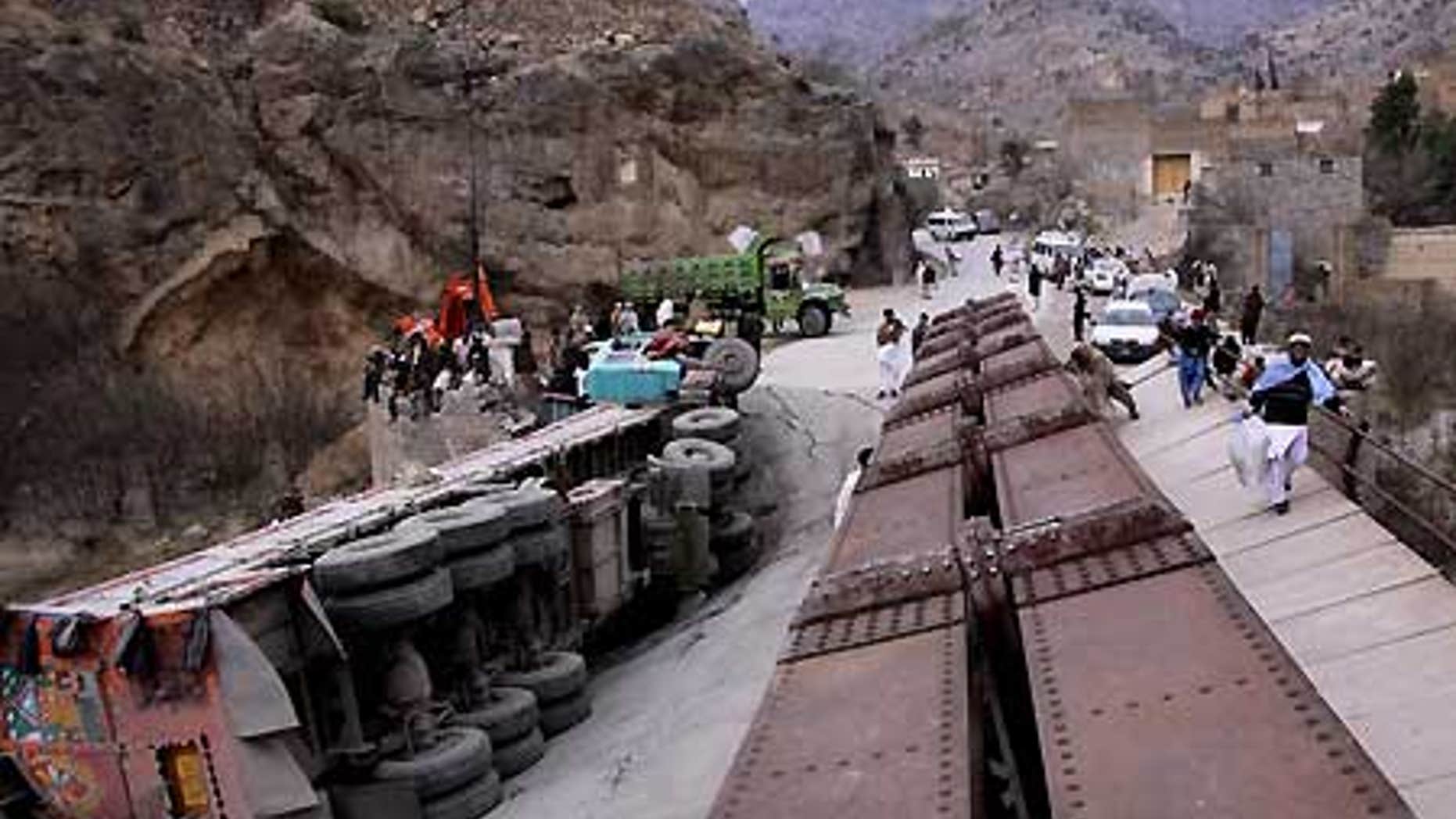 Feb. 3: A truck lies down on a bridge destroyed by alleged Islamic militants in the Pakistani tribal area of Khyber.