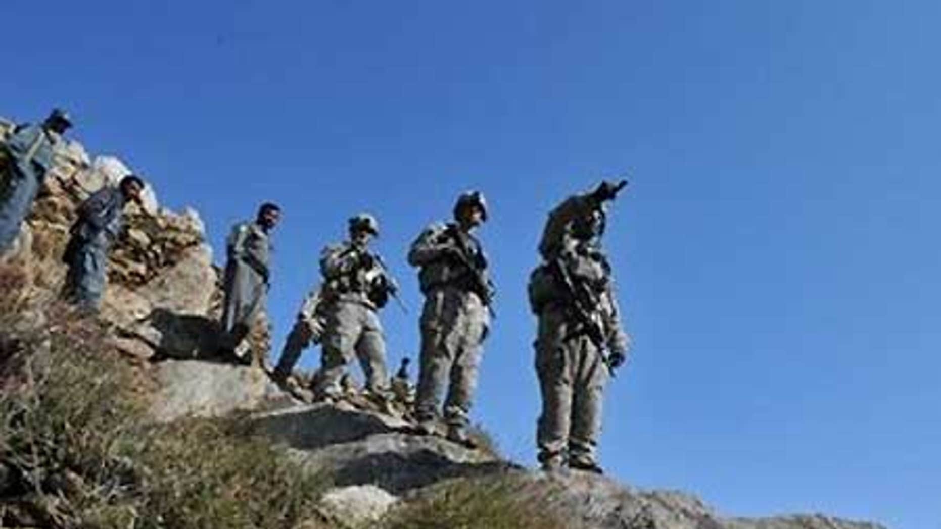 Feb. 17: U.S. troops patrol at Tag in Laghman. Pakistan has confirmed the capture of the Taliban's top military commander Mullah Abdul Ghani Baradar.