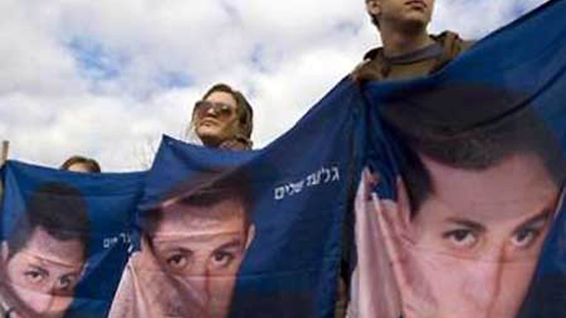 Feb. 18: Israeli demonstrators hold banners showing captured Israeli soldier Sgt. Gilad Schalit during a rally calling for his release in Jerusalem.