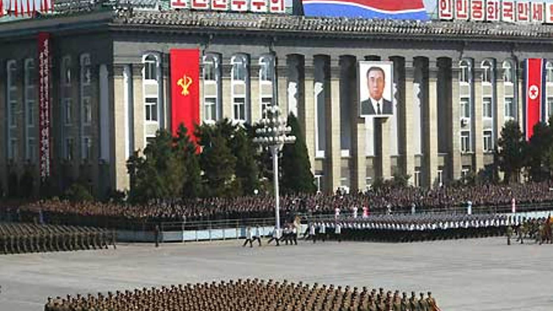 File: North Korean soldiers parade in front of Workers' Party of Korea headquarters building in Pyongyang.