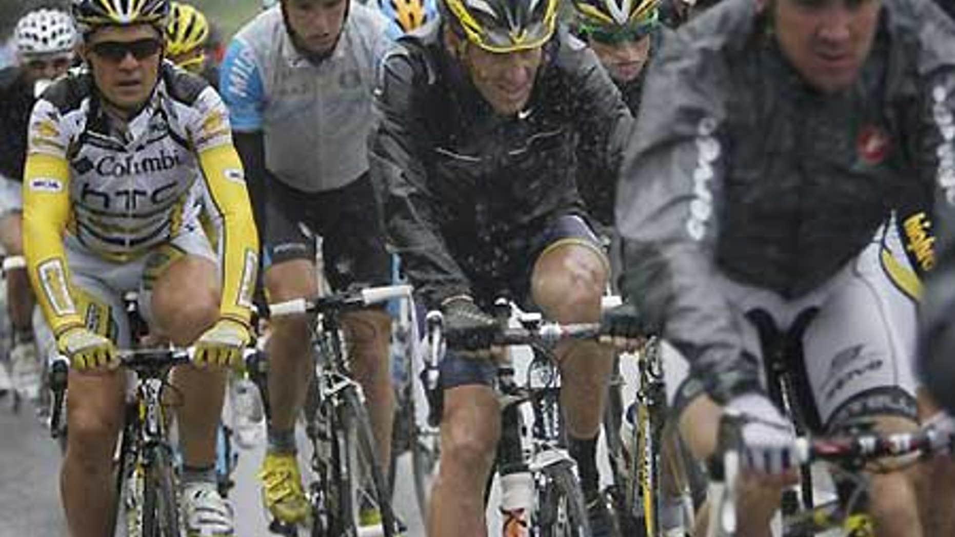 Lance Armstrong, center, in the pack during the 13th Stage of the Tour de France.