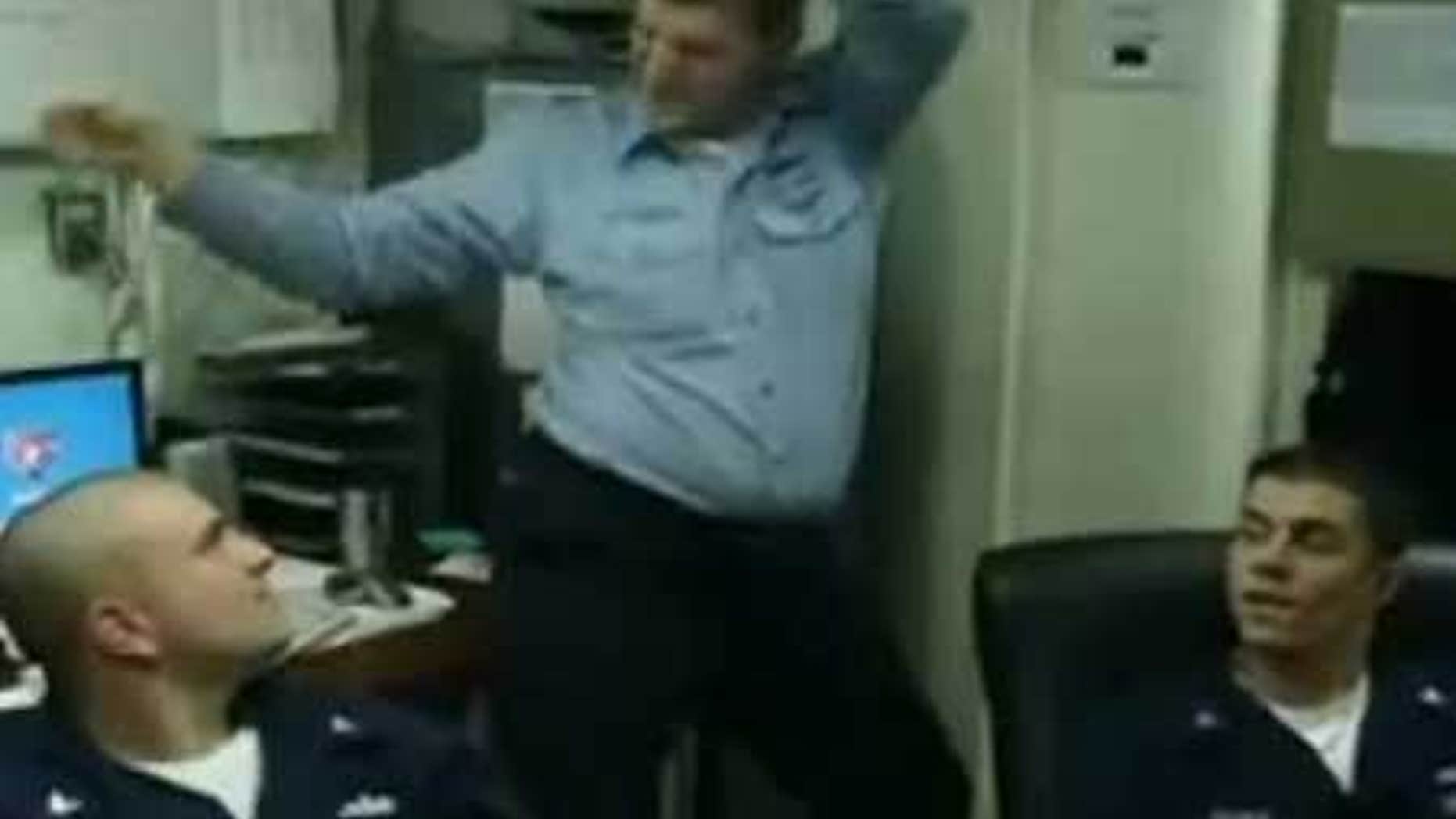 An unidentified Navy sailor, flanked by two others, dances in a YouTube video filmed by murder-suicide victim Michael Joseph Missimer.