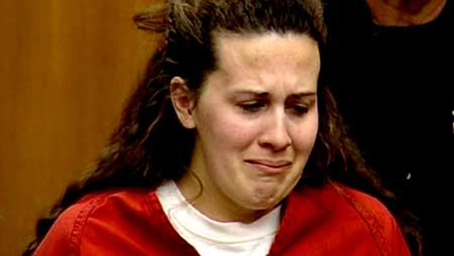 April 14: Melissa Huckaby cries as she hears the charges of murder against her in the death of Sandra Cantu.