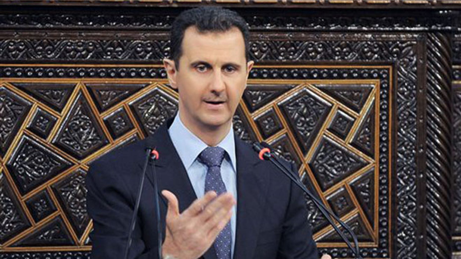 June 3, 2012: In a much-anticipated speech, embattled Syrian president Bashar al-Assad blames foreign powers and "terrorists" for the violence that has wracked the country for the last 15 months. (AP)