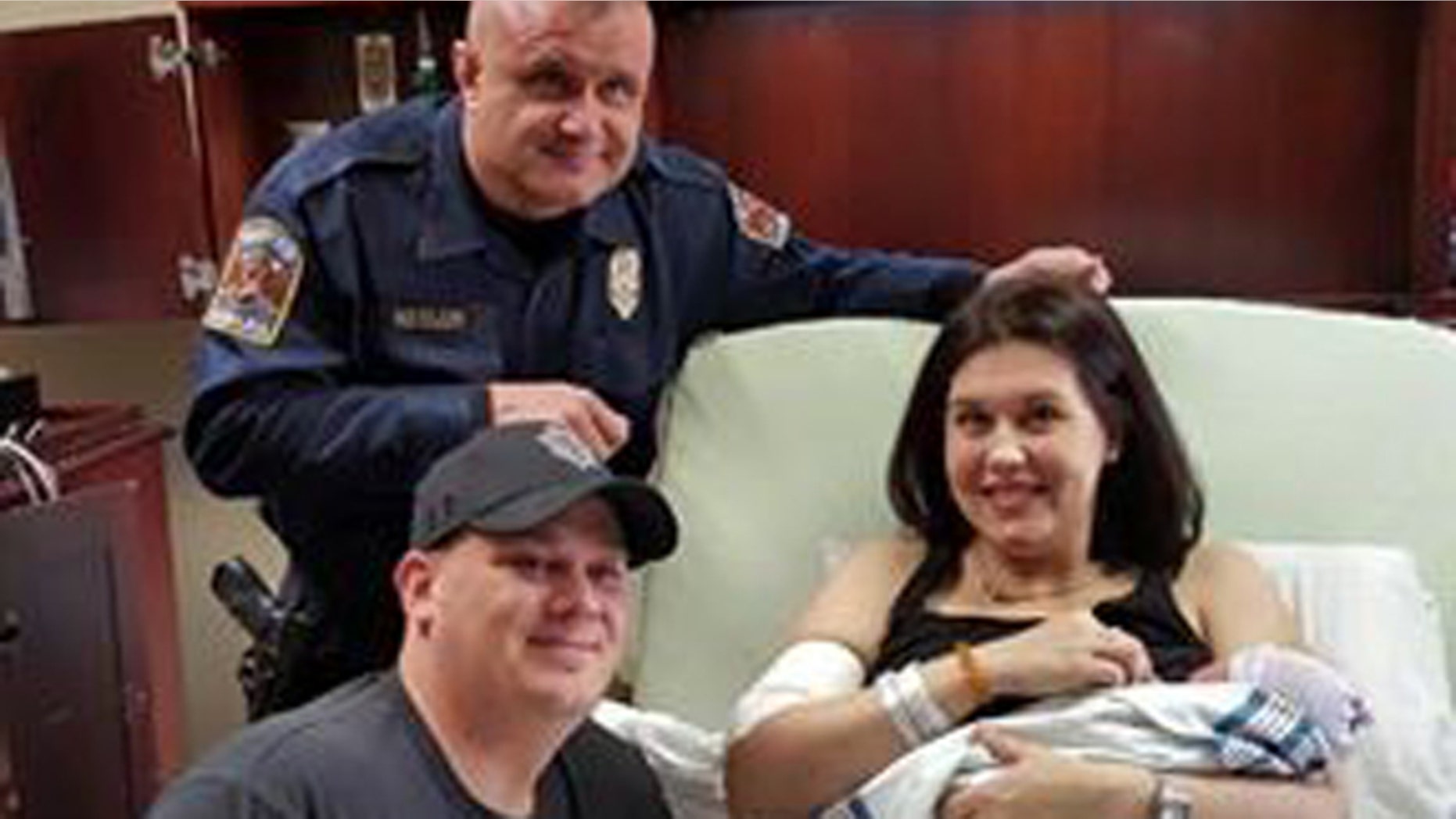 Trooper Michael Kesler with the new parents.
