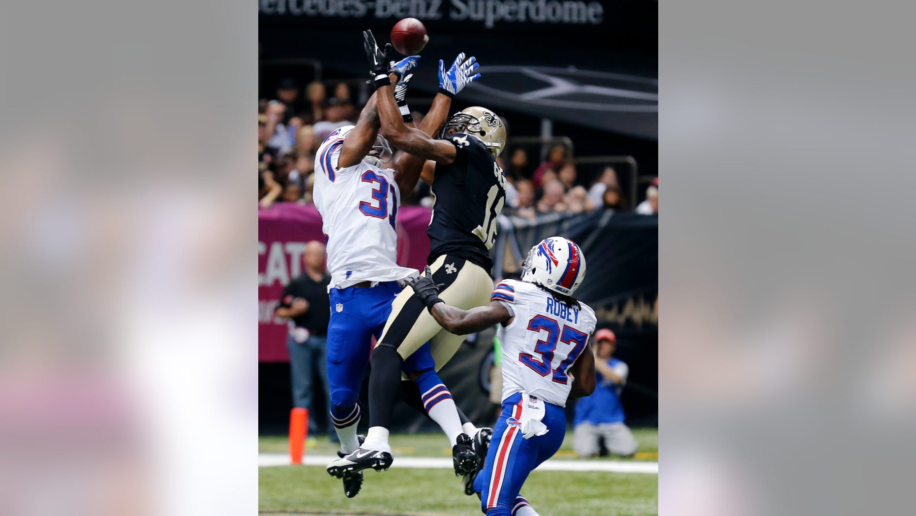 Buffalo Bills free safety Jairus Byrd (31) and defensive back Nickell Robey (37) break up a pass intended for New Orleans Saints wide receiver Marques Colston (12) during the first half of an NFL football game in New Orleans, Sunday, Oct. 27, 2013. (AP Photo/Bill Haber)
