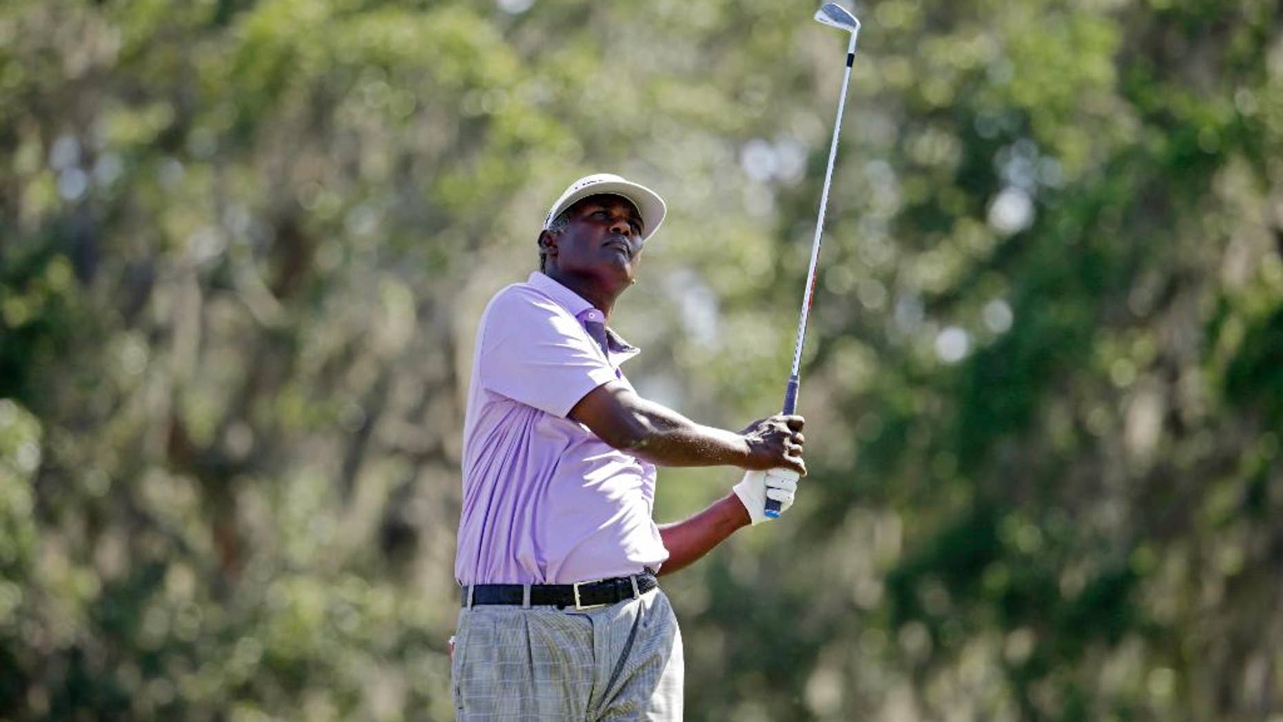 Vijay Singh, of Fiji, watches his shot from the 12th tee during the second round of The Players Championship golf tournament Friday, May 12, 2017, in Ponte Vedra Beach, Fla. (AP Photo/Lynne Sladky)