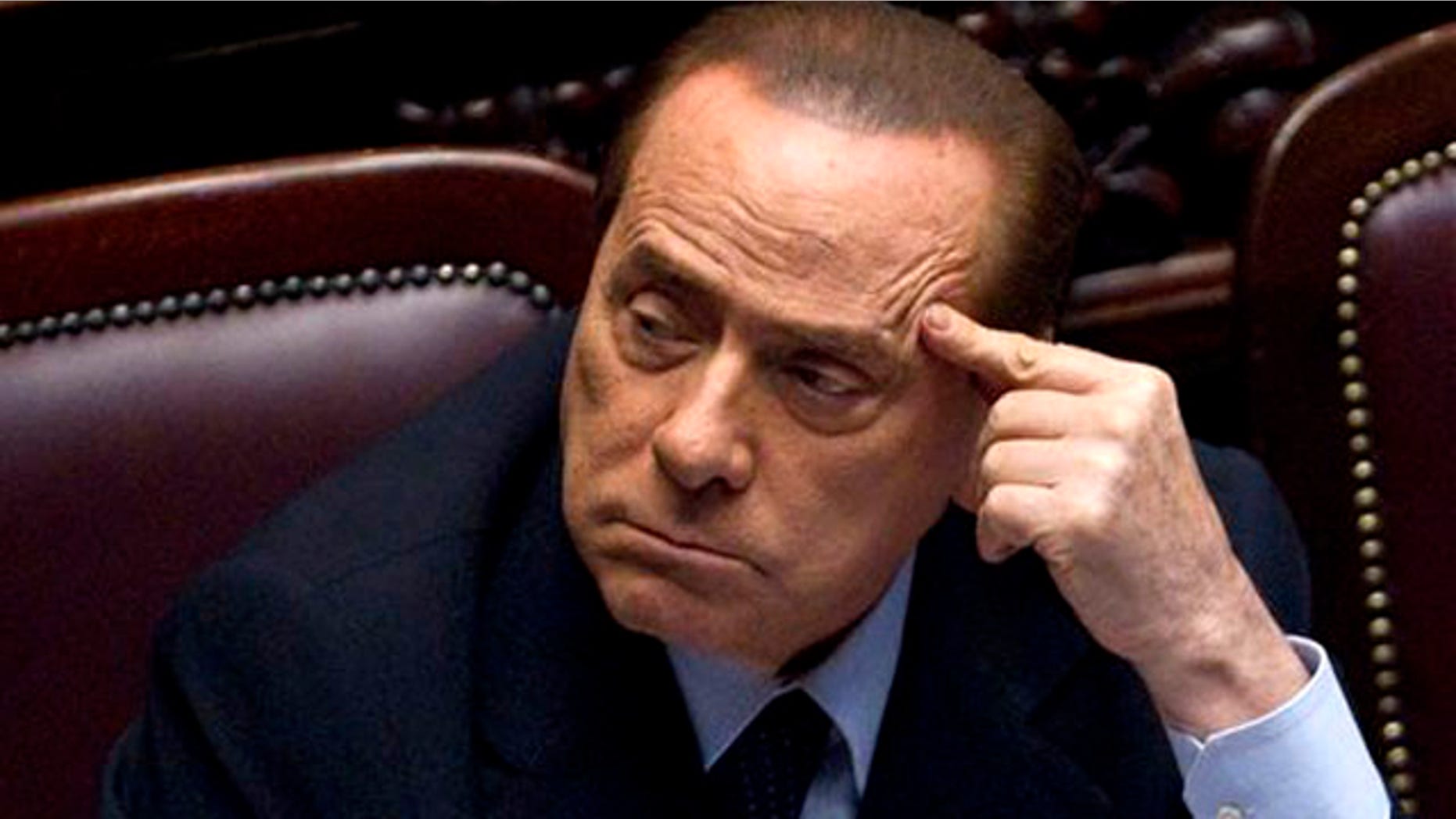 Italian Premier Silvio Berlusconi votes over a crucial austerity package.