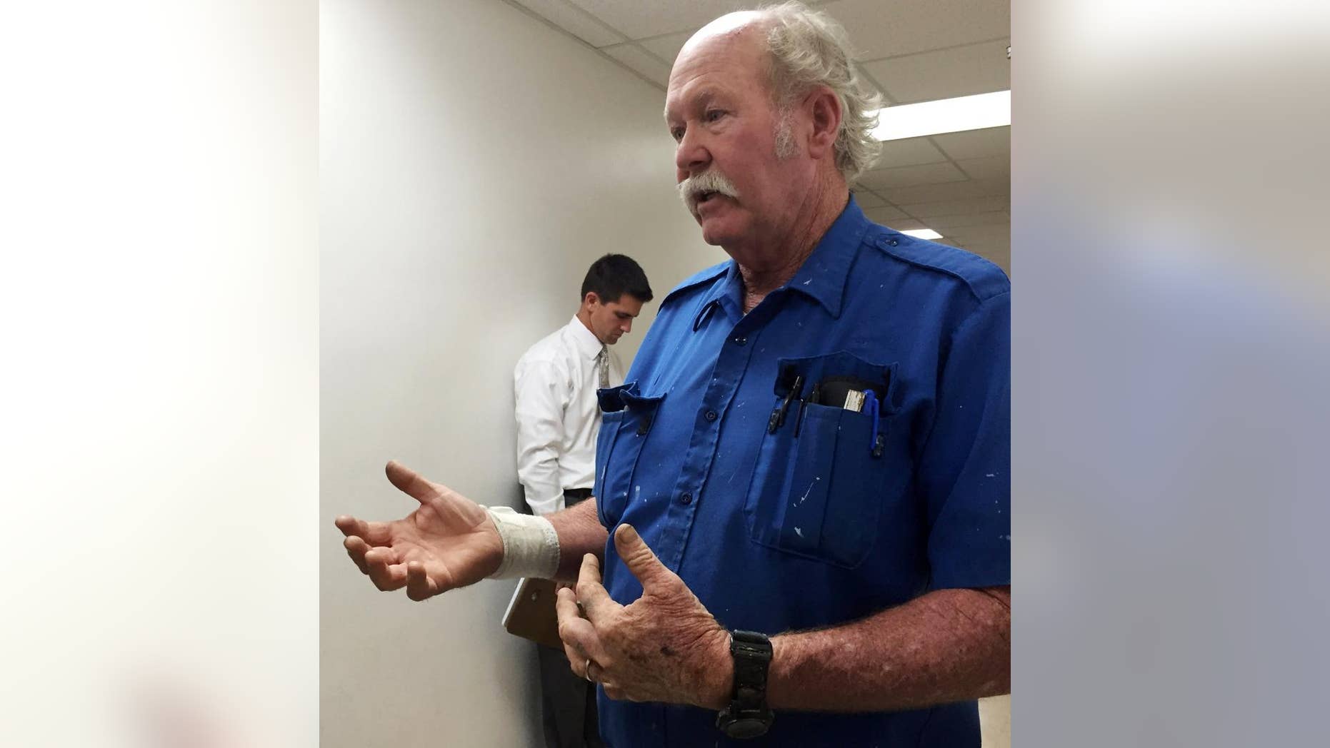 Pastor Bob Carswell, injured during a shooting at Oasis Tabernacle Church, speaks with members of the media outside a hearing at the Dallas County Courthouse in Selma, Ala., on Monday, Sept. 21, 2015. A witness said Carswell and church members helped subdue a gunman who opened fire during Sunday worship. (AP Photo/Kim Chandler)