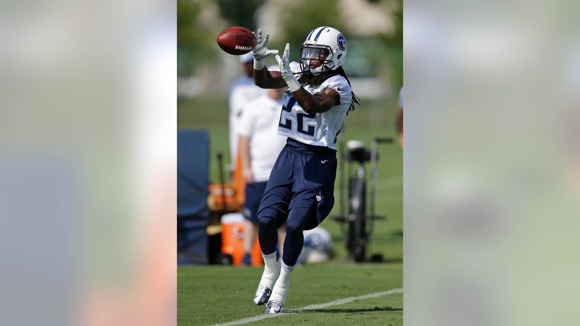 Tennessee Titans running back Dexter McCluster runs a drill during an NFL football training camp Saturday, July 26, 2014, in Nashville, Tenn. (AP Photo/Mark Humphrey)