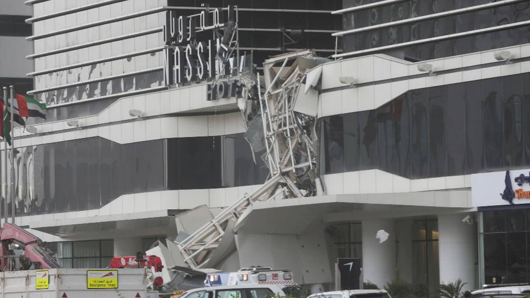 A construction crane has collapsed during high winds on the main highway running through Dubai, disrupting traffic in the heart of the Mideast's commercial hub in Dubai, United Arab Emirates, Friday, Feb. 3, 2017. (AP Photo/Kamran Jebreili)