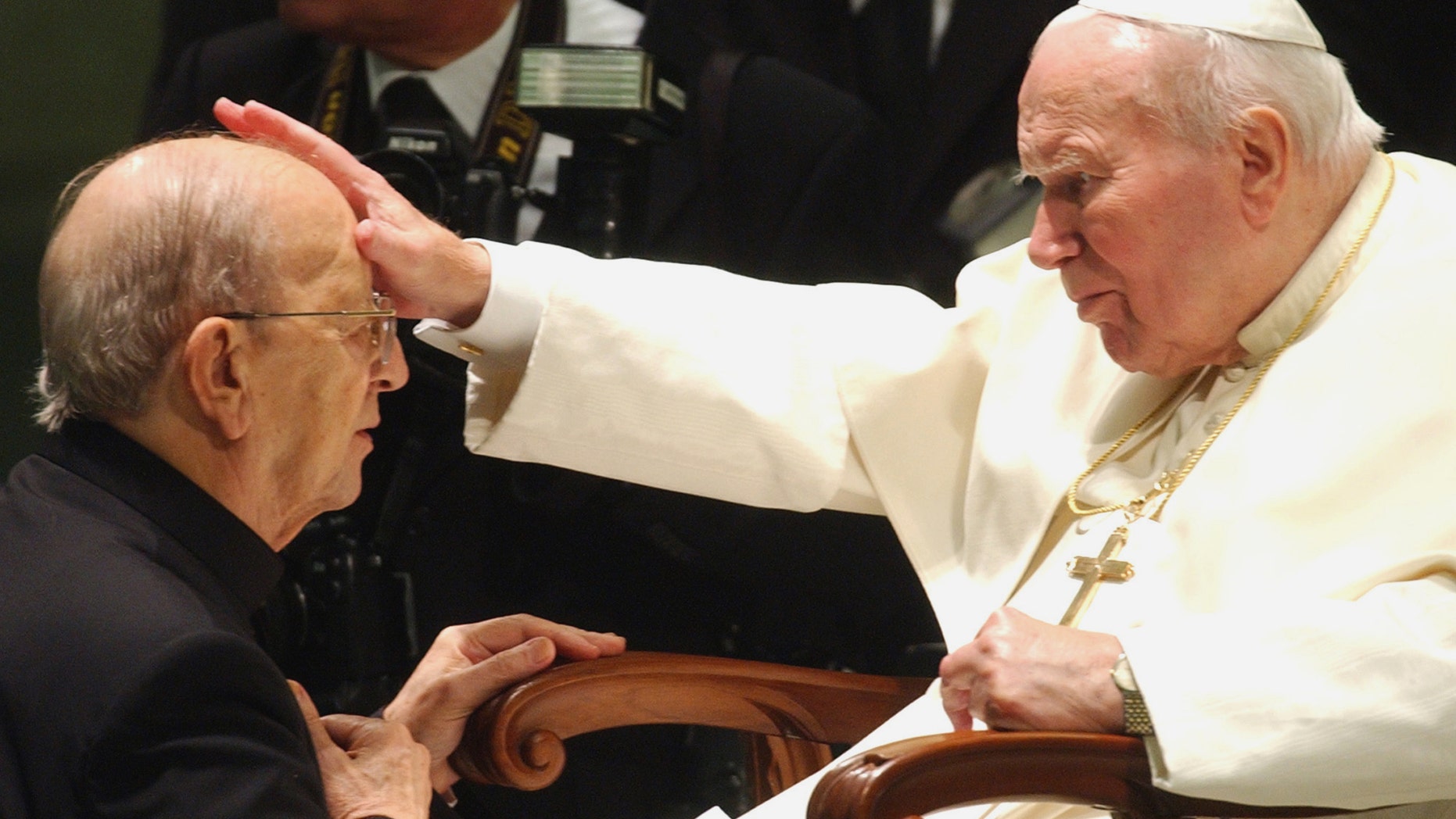 FILE - In this Nov. 30, 2004 file photo, Pope John Paul II gives his blessing to father Marcial Maciel, founder of the Legion of Christ, during a special audience at the Vatican. Pope Benedict XVI took over the Legion in 2010 after a Vatican investigation determined that Maciel had sexually molested seminarians and fathered three children by two women. Following a decision Thursday Feb. 14, 2013, by the Rhode Island Supreme Court, documents have been unsealed related to a lawsuit contesting the will of Gabrielle Mee, who left $60 million to the Legion. (AP Photo/Plinio Lepri, File)