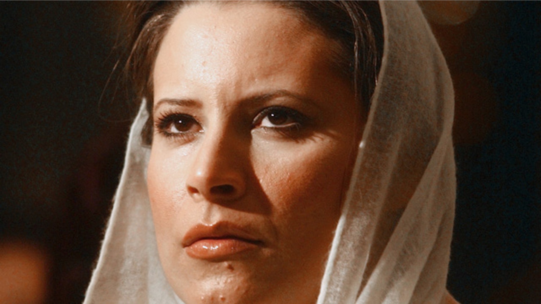 FILE 2005: Aisha Qaddafi, the daughter of Libyan leader Moammar Qaddafi, looks on before making a speech on the achievement of Libyan women in Cairo.