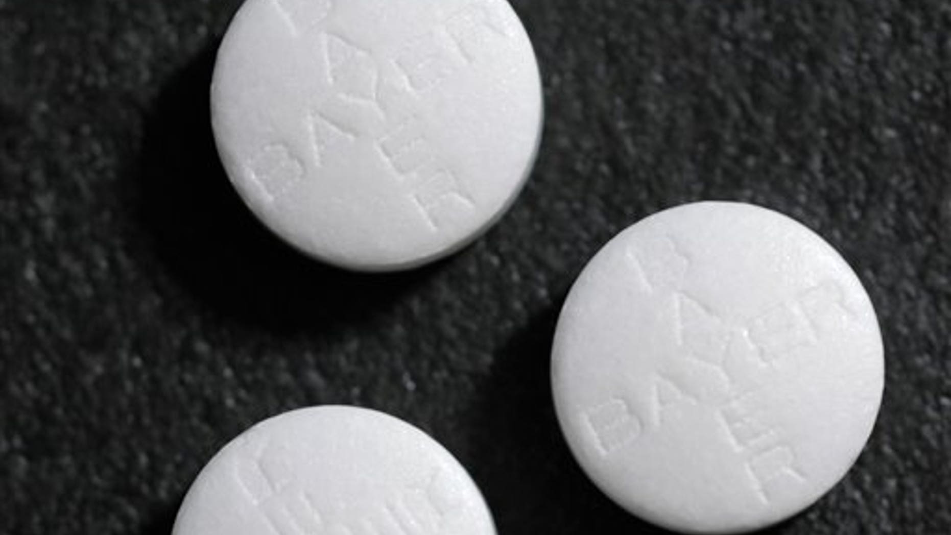 FILE - This May 25, 2004 file photo shows aspirin tablets. Aspirin, one of the world's oldest and cheapest drugs, has shown remarkable promise in treating colon cancer in people with certain genetic mutations that often play a role in the disease. The study appears in the Thursday, Oct. 25, 2012 New England Journal of Medicine. (AP Photo/Houston Chronicle, Dave Einsel)
