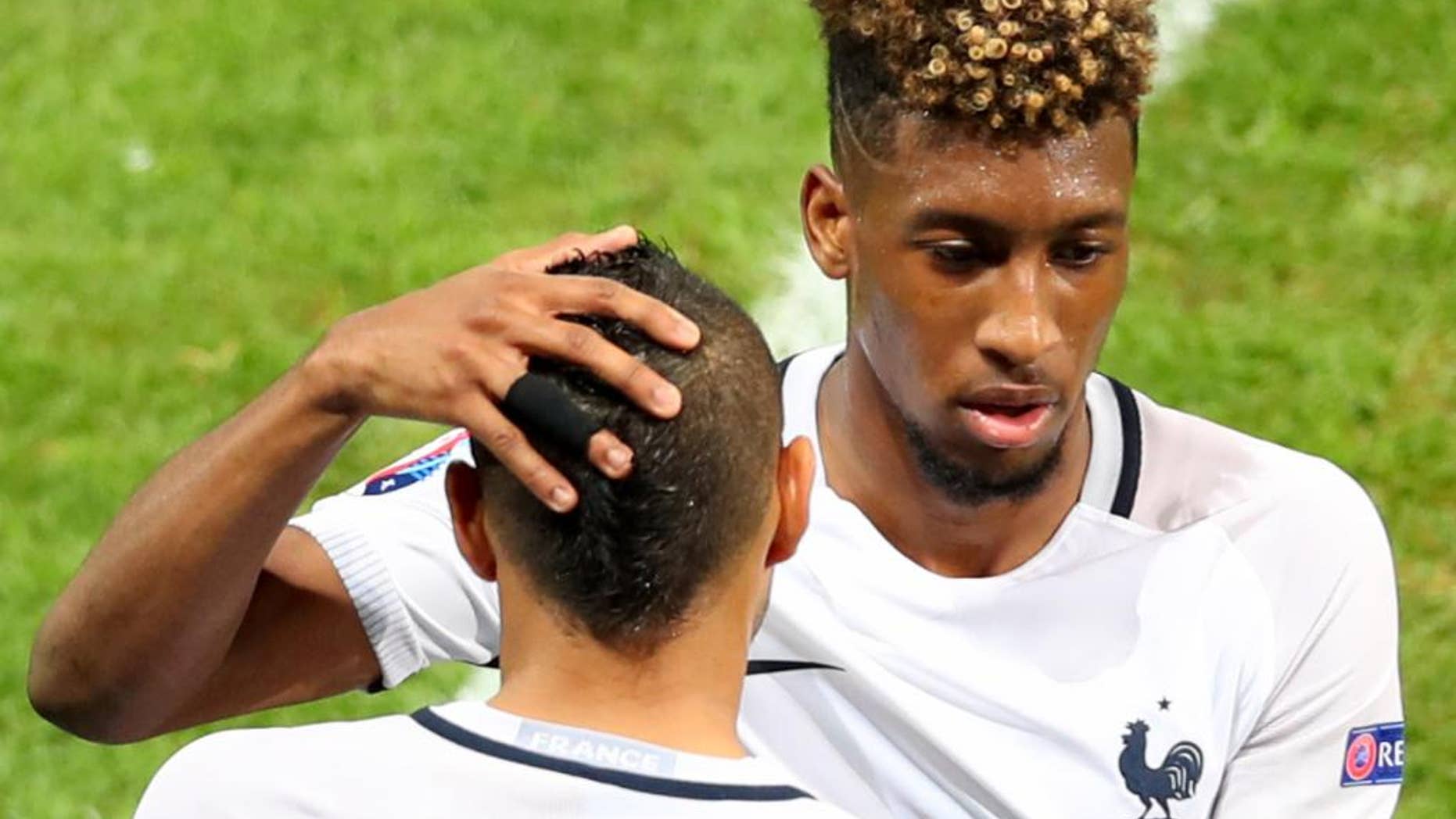 France's Kingsley Coman is replaced by Dimitri Payet during the Euro 2016 Group A soccer match between Switzerland and France at the Pierre Mauroy stadium in Villeneuve d’Ascq, near Lille, France, Sunday, June 19, 2016. (AP Photo/Thibault Camus)