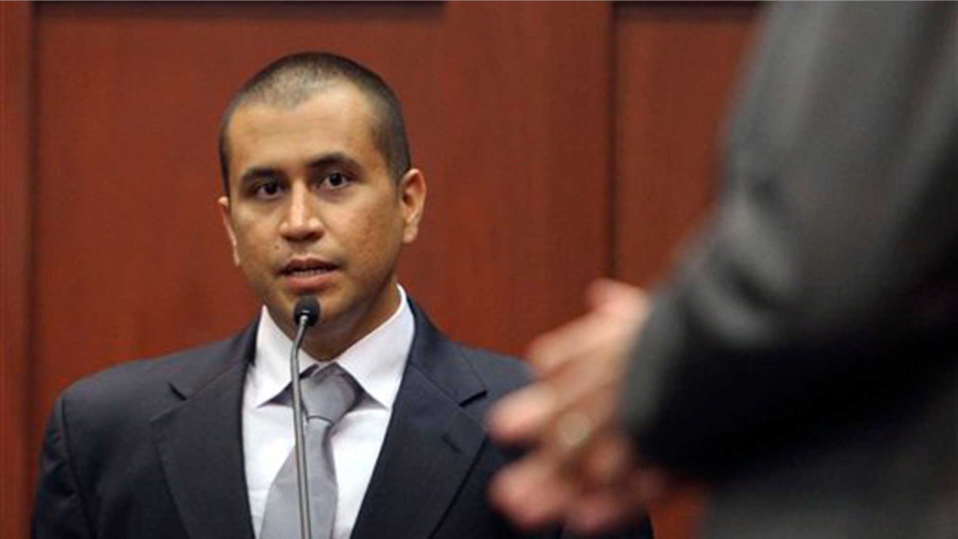 April 20, 2012: In this file photo, George Zimmerman, left, answers a question from attorney Mark O'Mara during a bond hearing in Sanford, Fla. (AP)