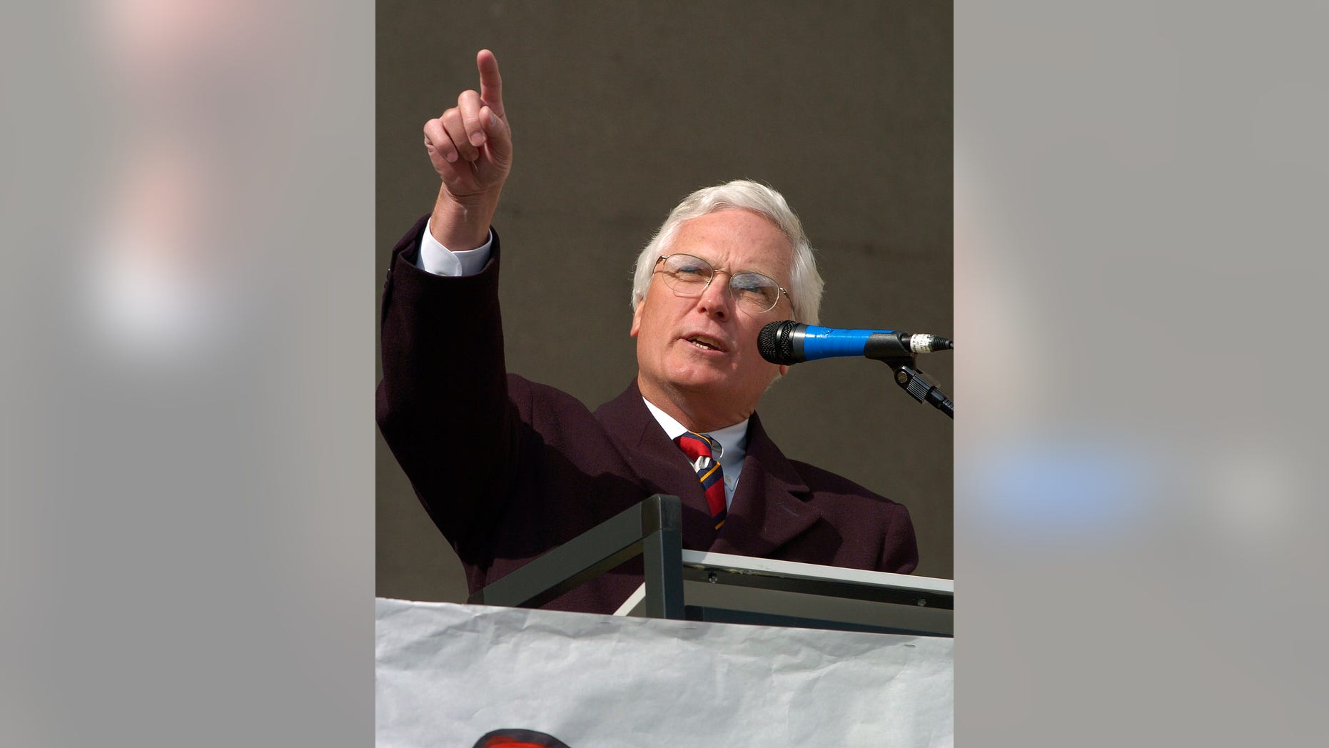 Former Jefferson County and District Court Judge Michael O'Connell gestures towards the Jefferson County Courthouse during a rally Sunday April 24, 2005 at in Louisville, Ky. The rally was held to counter the Justice Sunday rallies held today. (AP Photo/Timothy D. Easley)