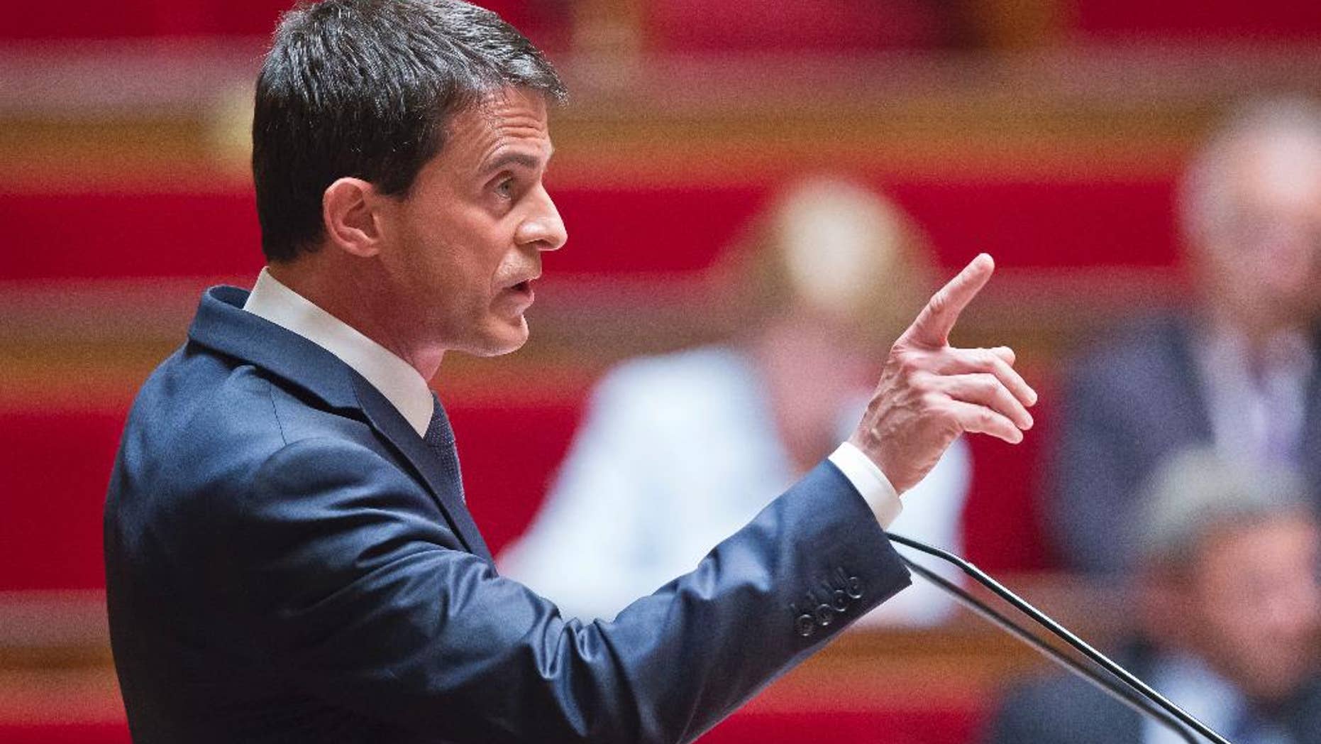 French Prime Minister Manuel Valls delivers a speech during the labor law debate at the national assembly in Paris, France, Thursday, May 12, 2016. France's government is facing a major test as lawmakers hold a no-confidence vote, prompted by a deeply divisive labor law allowing longer workdays and easier layoffs. (AP Photo/Michel Euler)