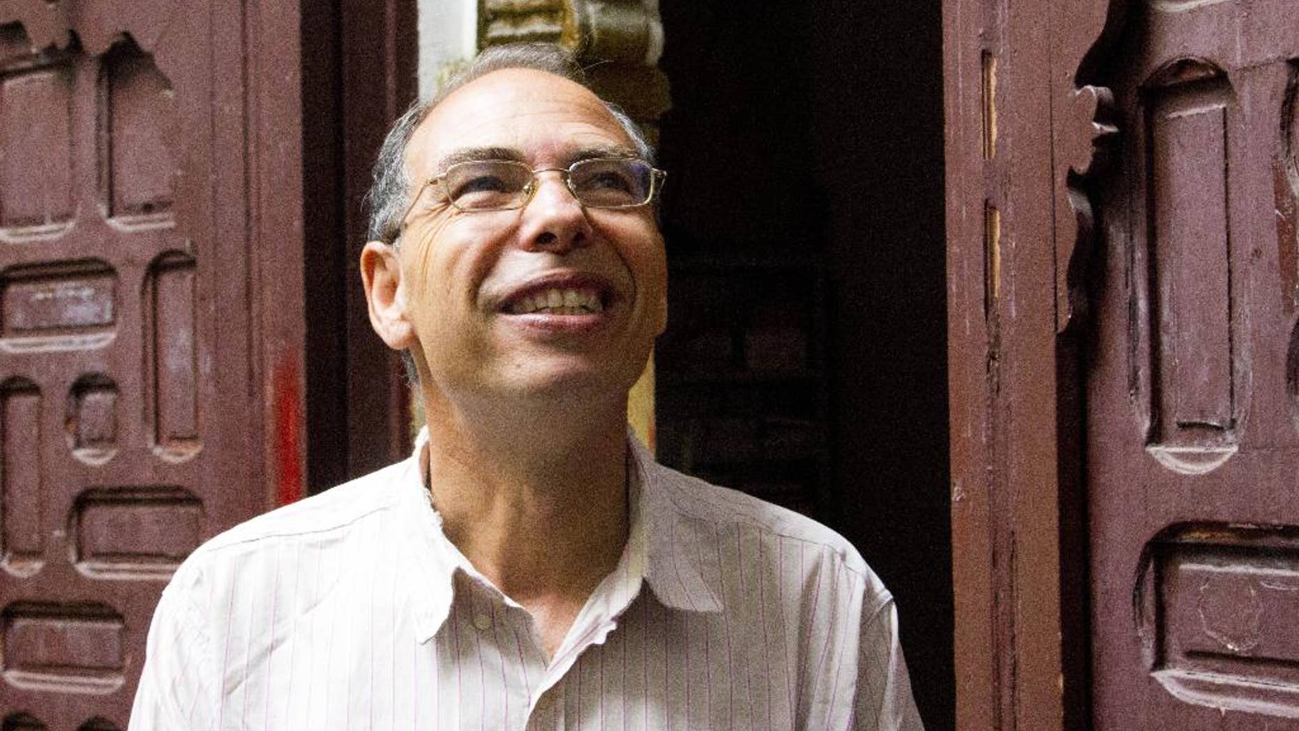 FILE - This Thursday Sept. 17, 2015 file picture shows Moroccan historian and journalist Maati Monjib standing outside the local headquarters of a human rights group in Rabat, Morocco. After a week of being on hunger strike Moroccan journalist and historian, Maati Monjib, was hospitalized Tuesday night. This is Monjib's second hunger strike in a two-month period, in protest of a travel ban. (AP Photo/Paul Schemm, File)