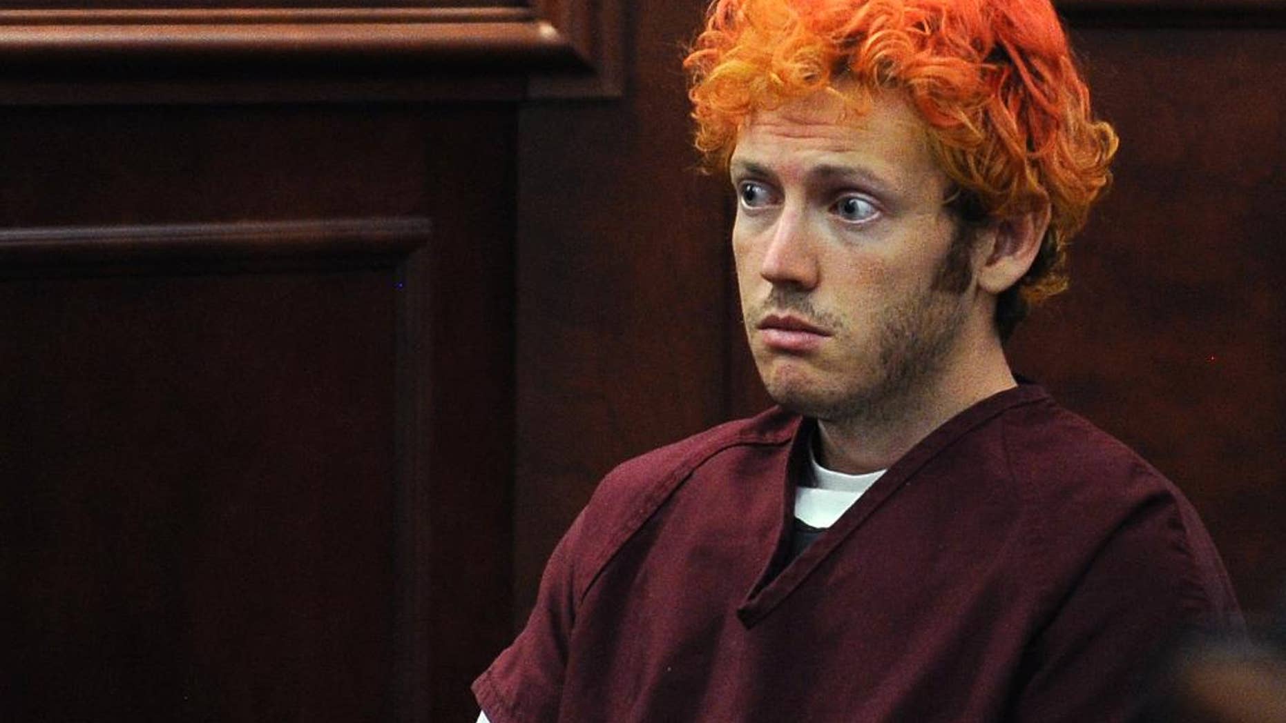 FILE - In this July 23, 2012, file photo, James Holmes, who is charged with killing 12 moviegoers and wounding 70 more in a shooting spree in a crowded theatre in Aurora, Colo., in July 2012, sits in Arapahoe County District Court in Centennial, Colo. In a videotape played for jurors in Holmes' murder trial Tuesday, June 2, 2015, Holmes said that he might not have carried out the attack if his previous psychiatrist, Dr. Lynne Fenton, hadn't prescribed him a drug that reduced his anxiety and fear, but said he might have done it later in life. (RJ Sangosti, Denver Post via AP, Pool, File)