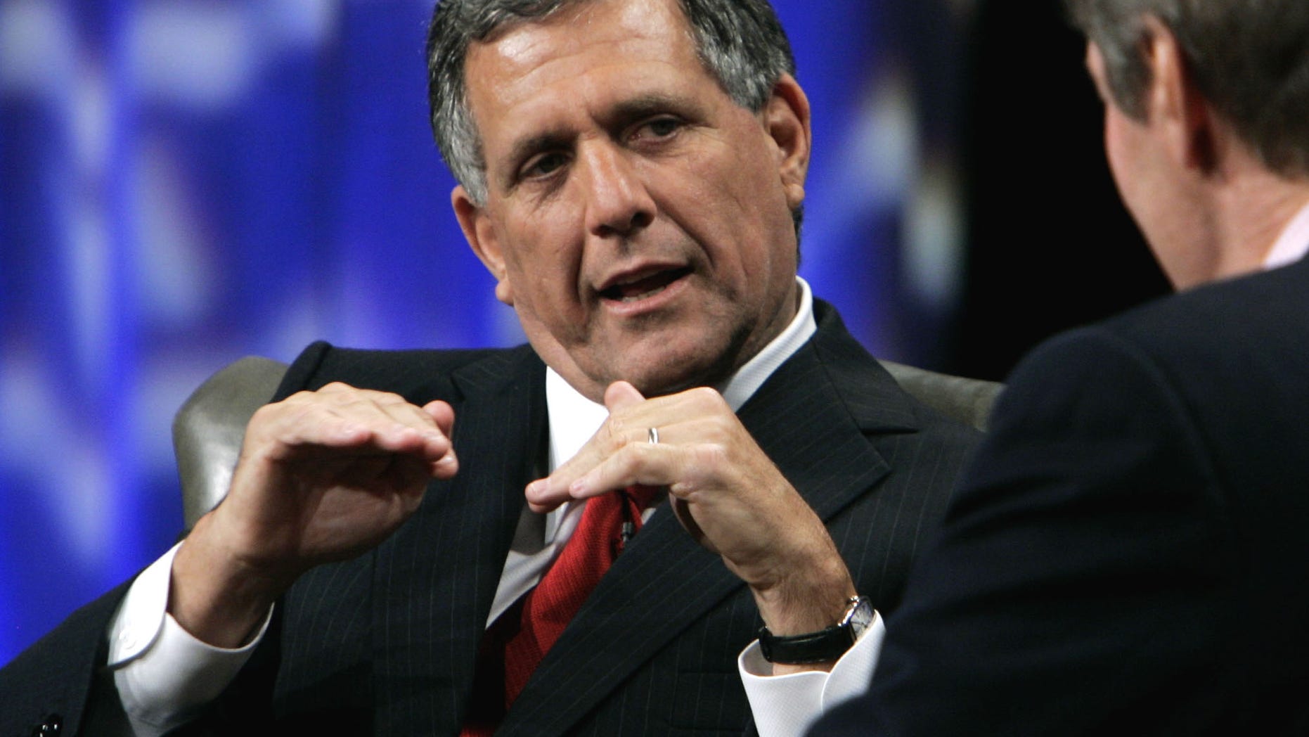 FILE -In this Tuesday, Sept. 12, 2006, file photo, Leslie Moonves, left, president and chief executive officer of CBS, talks with PBS host Charlie Rosein Beverly Hills, Calif. CEO pay has been going up, The highest paid CEO in 2012 was Leslie Moonves of CBS, who made $60.3 million. (AP Photo/Reed Saxon, File)