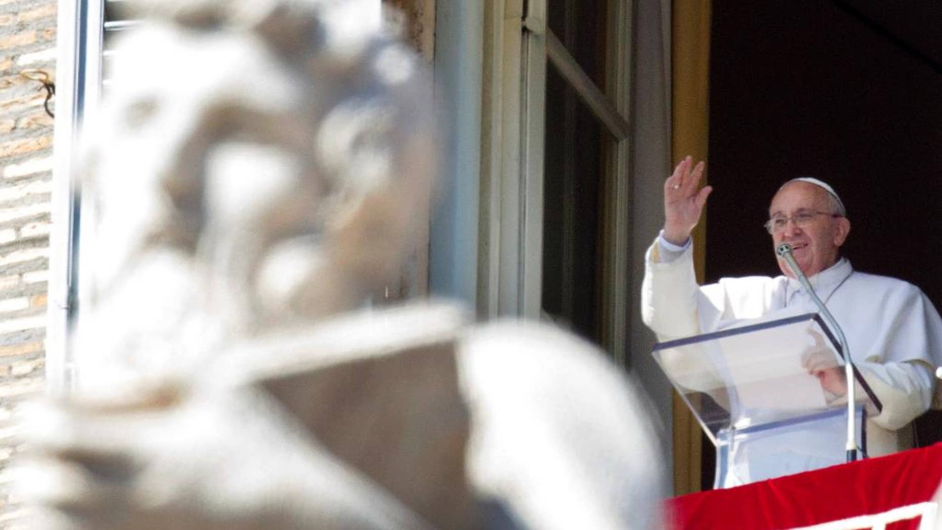 FILE - In this Sunday, March 8, 2015 file photo, Pope Francis recites the Angelus noon prayer from his studio window overlooking St. Peter's Square at the Vatican. A Vatican official who helped write a first draft of Pope Francis’ upcoming encyclical on climate change acknowledged disagreement over the causes of global warming but said "what is not contested is that our planet is getting warmer" and Christians have a duty rooted in "ancient biblical teaching" to address the problem. (AP Photo/Riccardo De Luca)