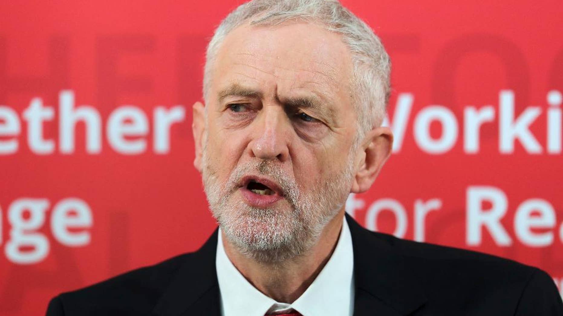 Labour Party leader Jeremy Corbyn speaks during a visit to Paston Farm Centre in Peterborough, England where he outlined the party's plan for Brexit and vision for Britain. Tuesday Jan. 10, 2017. Corbyn Britain's main opposition leader, seeking to start the year with new political momentum, has suggested imposing a national maximum wage. Corbyn told the BBC Tuesday that "I would like to see some kind of high-earnings cap" to reduce inequality. (Chris Radburn/PA via AP)