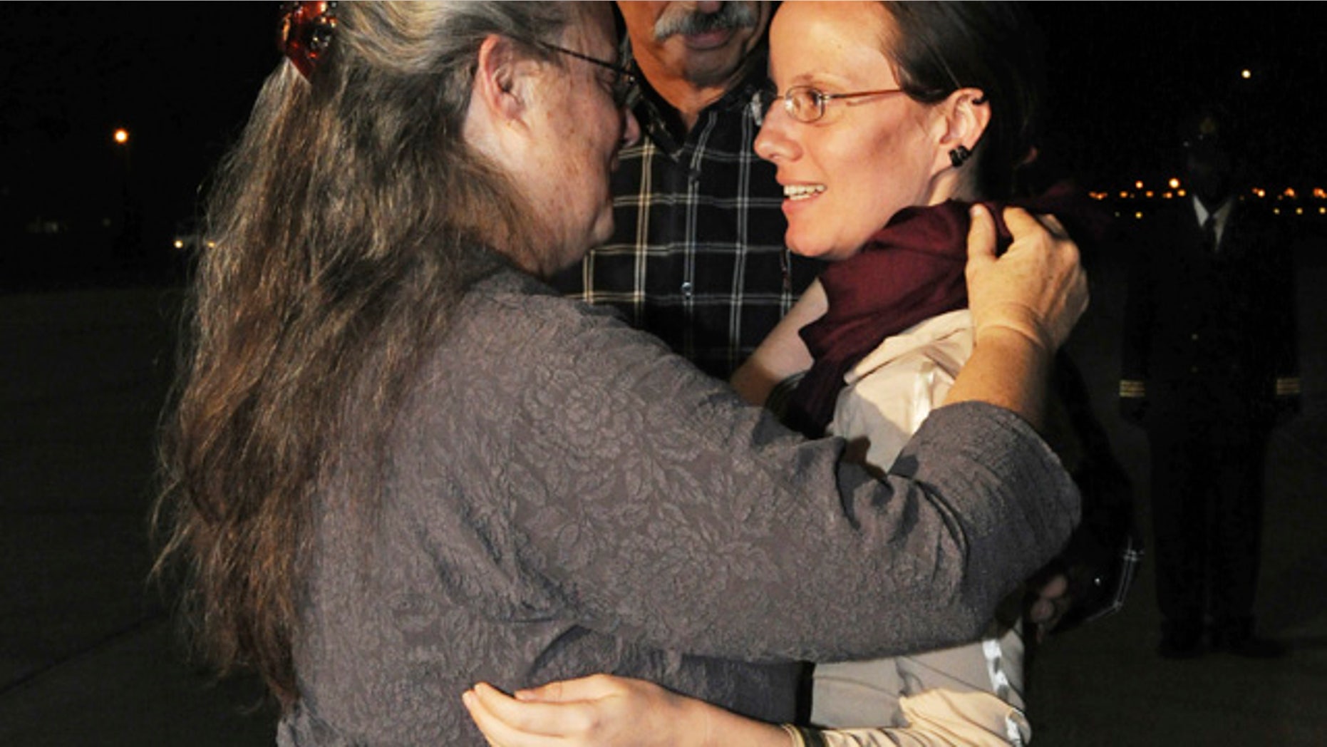 Sept. 2010: Sarah Shourd embraces her mother Nora Shourd upon arrival at the royal airport in Muscat, Oman.