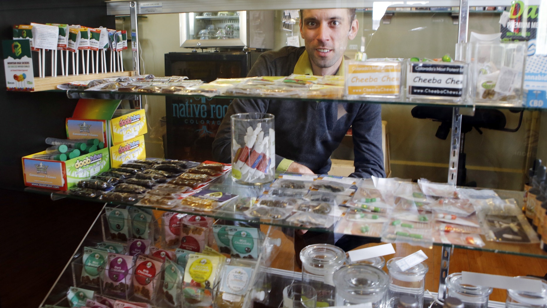 April 11, 2013: Matt Brown, co-owner of Denver's new "My 420 Tours," looking over a sampling of marijuana edibles at a dispensary in Denver.