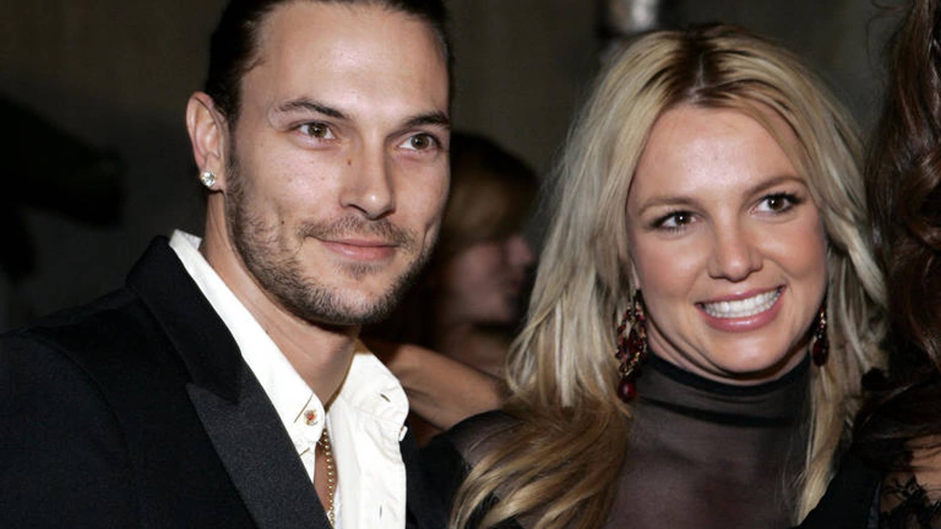 **FILE** Britney Spears, right, and her husband Kevin Federline are seen in this Feb. 8, 2006 file photo in Beverly Hills, Calif. Britney Spears' marriage to Kevin Federline officially ended Monday, July 30, 2007. "They are divorced," the pop star's attorney, Laura Wasser, said after a Superior Court hearing. "Everything is finalized." (AP Photo/Danny Moloshok, FILE)