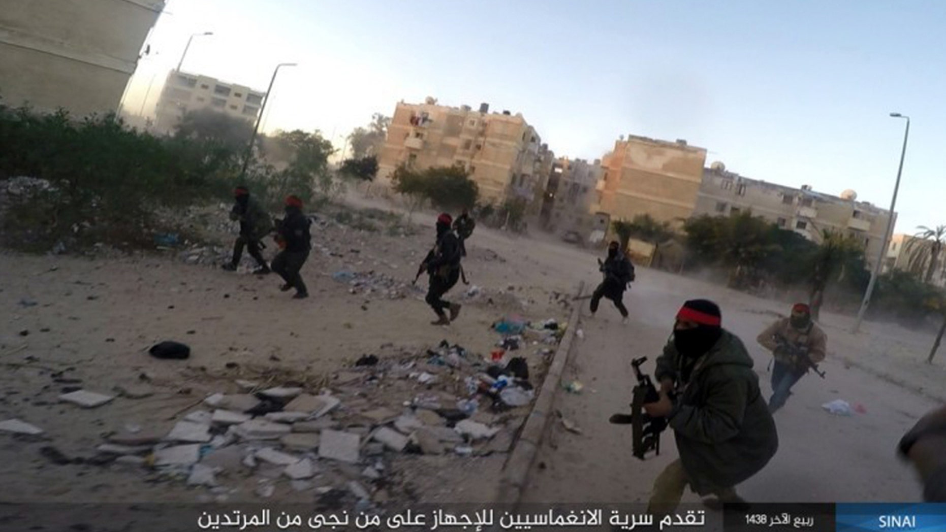 his photo posted on a file sharing website Wednesday, Jan. 11, 2017, by the Islamic State Group in Sinai, a militant organization, shows a deadly attack by militants on an Egyptian police checkpoint, in el-Arish, north Sinai, Egypt.