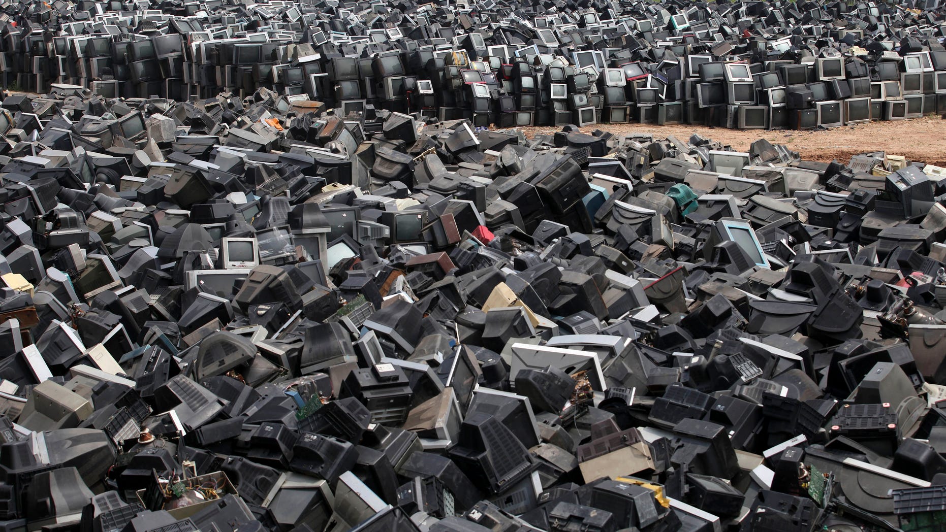 Aug. 26, 2013: Discarded television sets pile up in a scrap yard awaiting recycling in Zhuzhou city in south China's Hunan province. China’s recycling industry has boomed over the past 20 years. Its manufacturers needed the metal, paper and plastic and Beijing was willing to tolerate the environmental cost.