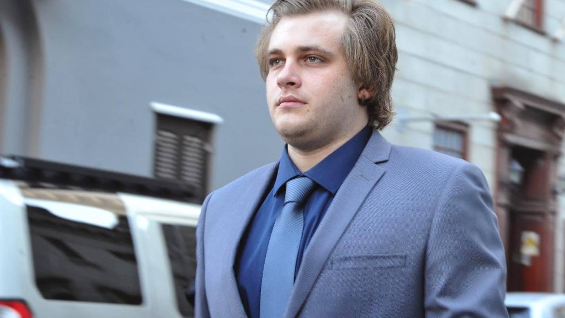 Henri Van Breda arrives at the High Court in Cape Town, South Africa, Monday, April 24, 2017. He is accused of murder of his parents and older brother in 2015. Breda pleaded not guilty to murder and to the attempted murder of his sister with an axe. (AP Photo)