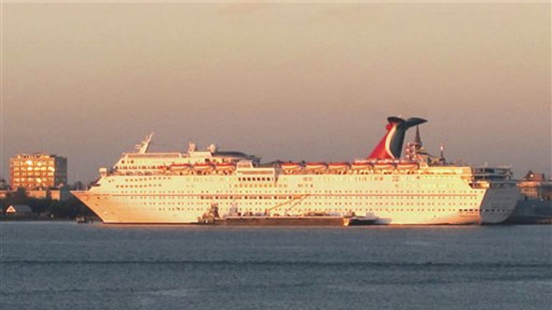 FILE: The Carnival Fantasy rests at its berth just after dawn in Charleston, S.C. South Carolina regulators on Tuesday approved a needed permit for the South Carolina State Ports Authority to build a new $35 million cruise passenger terminal.