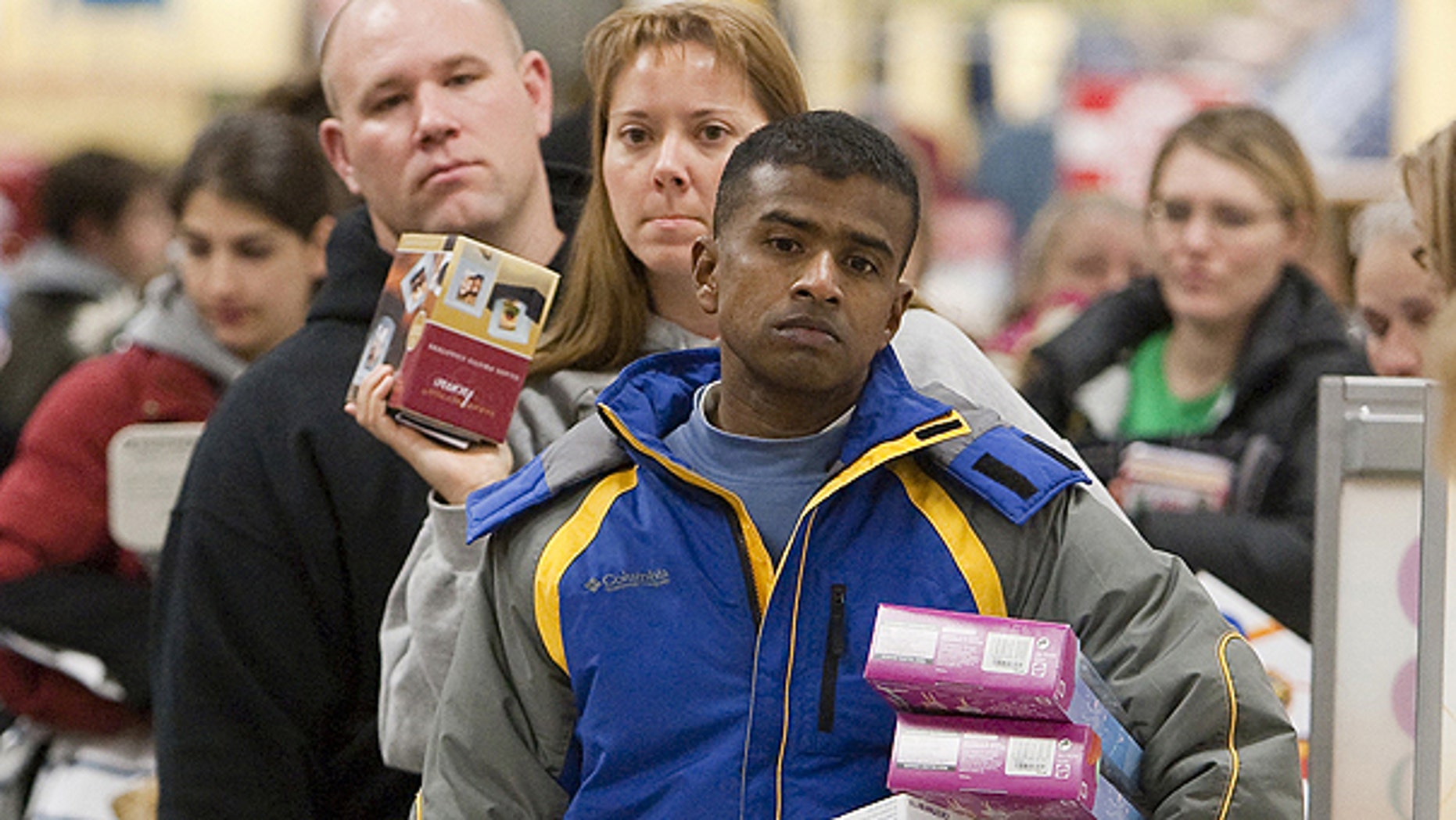 Nov. 27, 2009: Shoppers line up to pay for their purchases at a Kohl's store in Omaha, Neb., on Black Friday, the traditional start of the holiday shopping season.