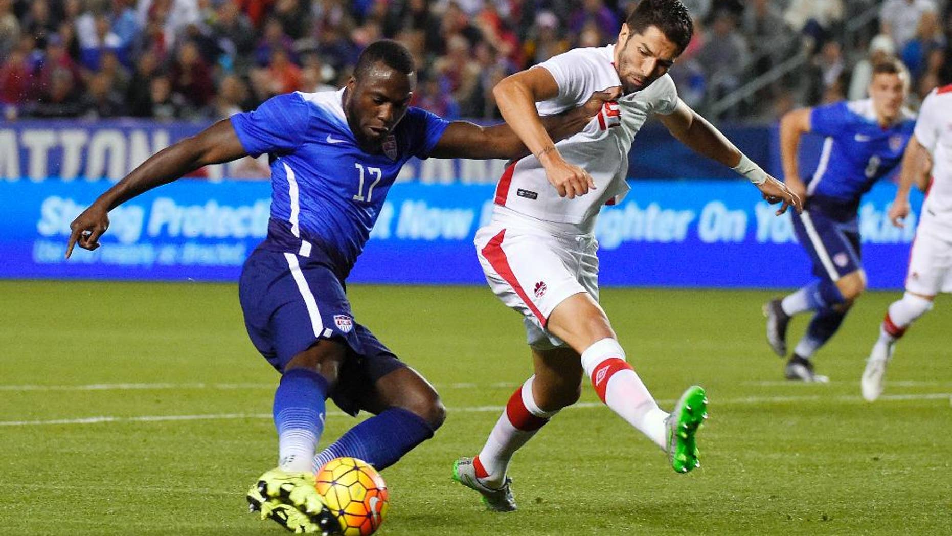 FILE - In this Friday Feb. 5, 2016, file photo, United States' Jozy Altidore, left, tries to shoot at goal as Canada's Steven Vitoria vie defends during the first half of an exhibition soccer match in Carson, Calif. Altidore appears certain to miss the Copa America Centenario following yet another hamstring injury.
Altidore, who hasn't scored for Toronto in Major League Soccer this season, got hurt Saturday, May 14, 2016, while taking a penalty kick against Vancouver that was saved. Toronto said Monday the 26-year-old will be sidelined for six-to-eight weeks. (AP Photo/Mark J. Terrill, File)