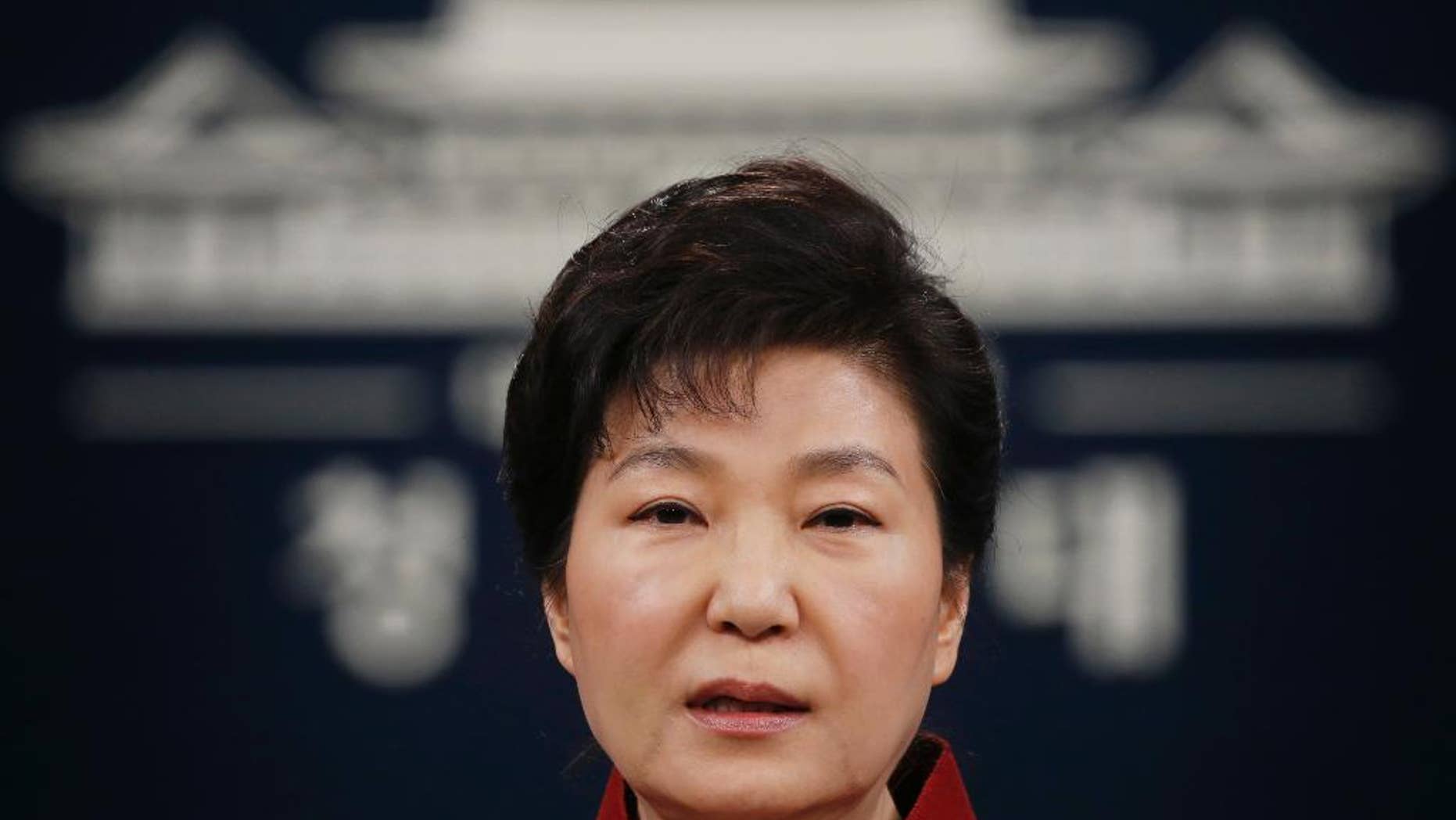 FILE - In this Jan. 13, 2016, file photo, South Korean President Park Geun-hye addresses the nation during her news conference at the Presidential Blue House in Seoul, South Korea. Upping its rhetoric a notch, North Korea warned Saturday, March 26, 2016, that it will attack Seoul’s presidential palace unless it receives an apology from South Korean President Park for “treason.” The warning is the latest threat against Washington and Seoul over joint U.S.-South Korean military drills now underway that the North sees as a dress rehearsal for invasion. (Kim Hong-ji/Pool Photo via AP, File)
