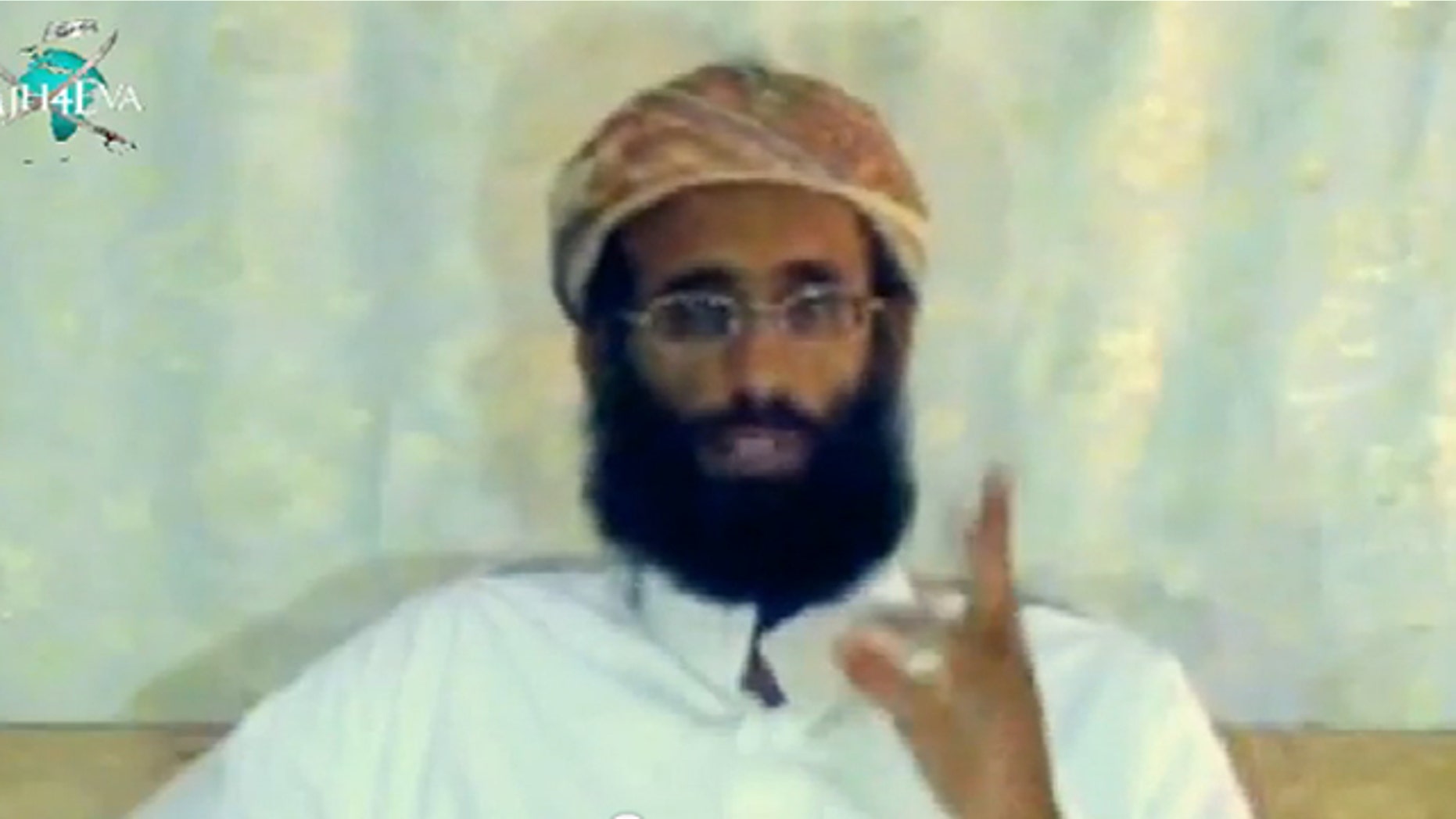 FILE: The late Anwar al-Awlaki in a 2009 video posted on YouTube