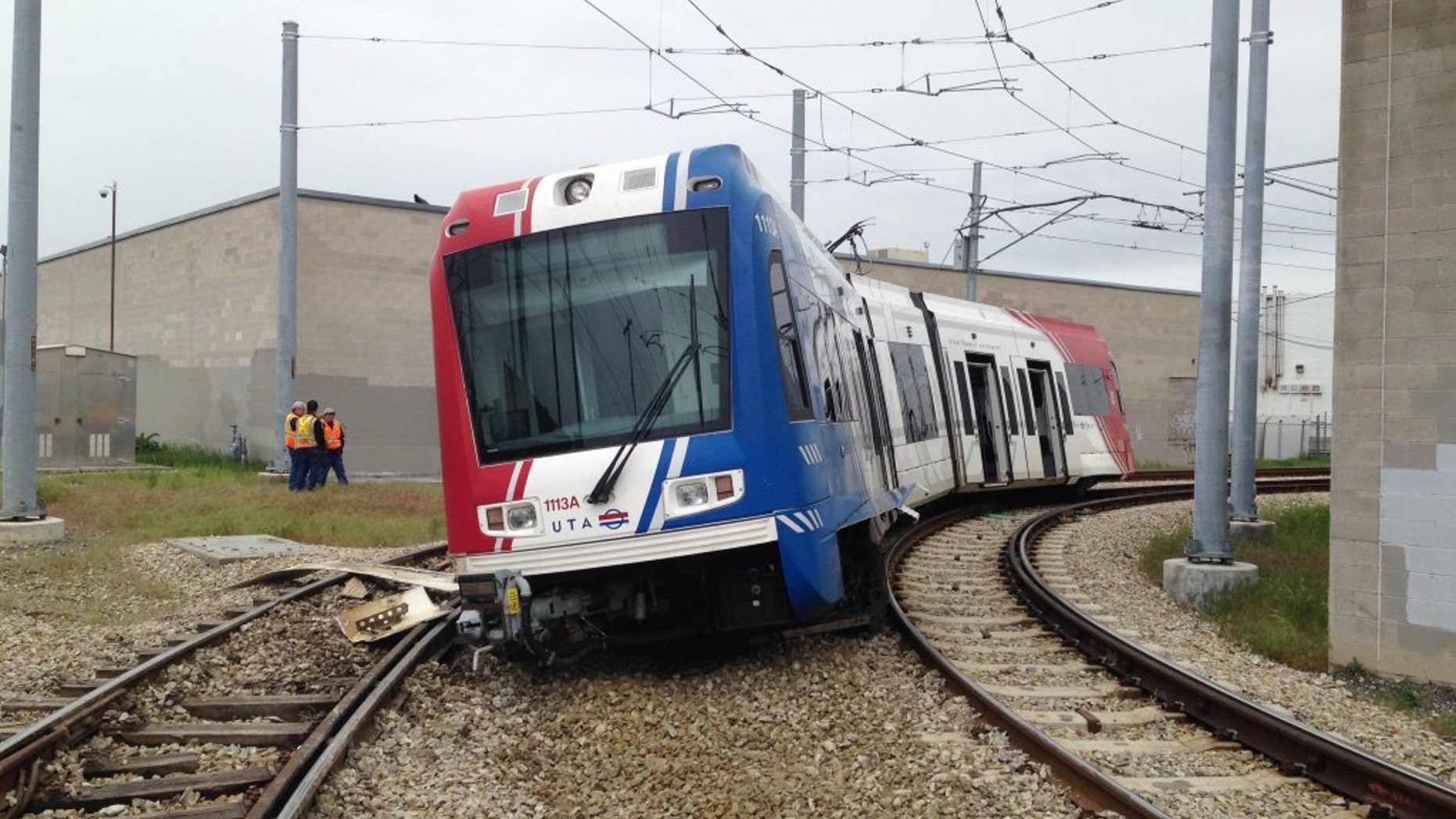 In this Sunday, May 8, 2016 photo provided by the Salt Lake City Fire Department, emergency personnel work at the scene of a train derailment, in South Salt Lake, Utah. (SLC Fire Department via AP)