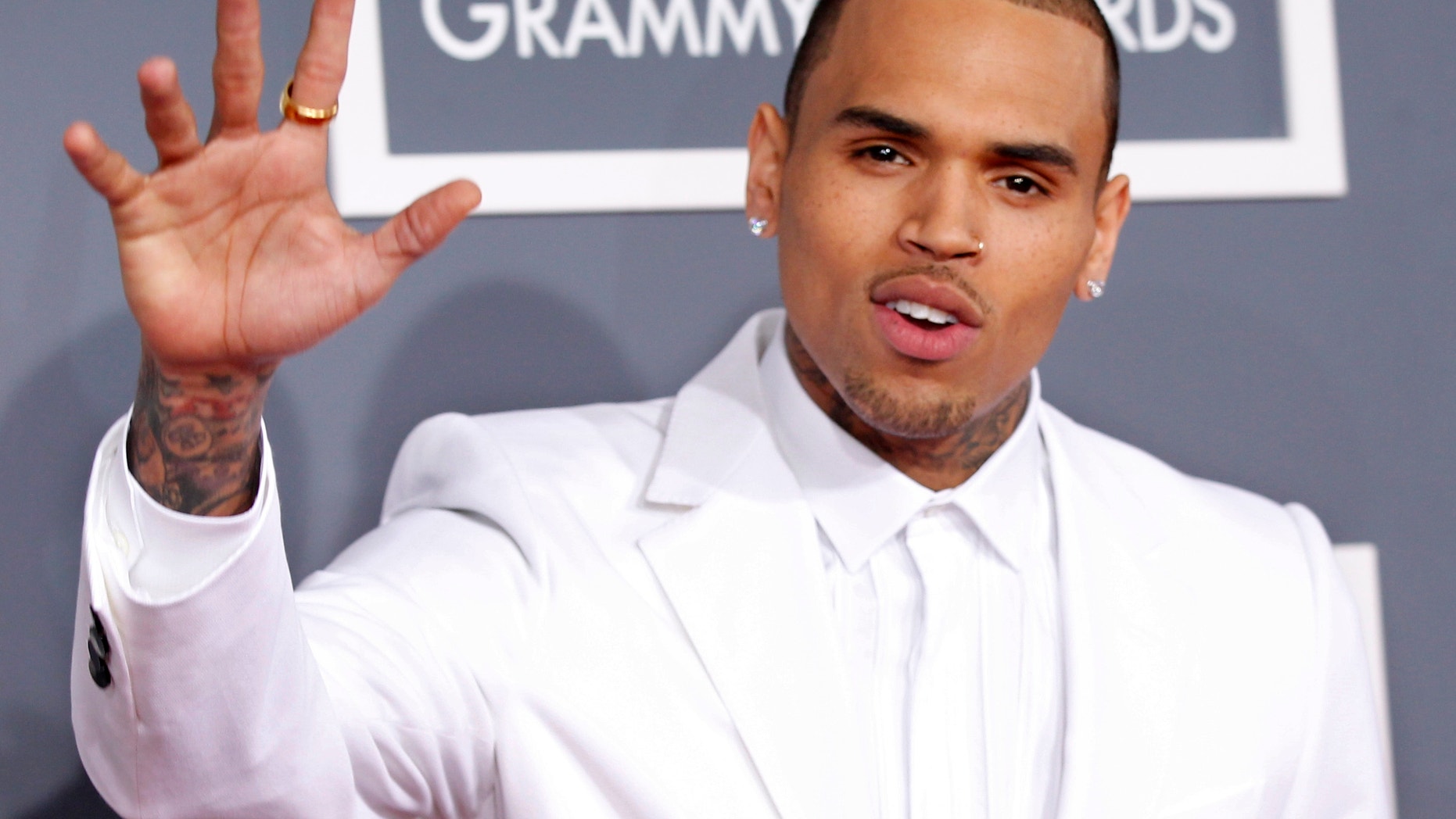 Chris Brown arrives at the 55th annual Grammy Awards.