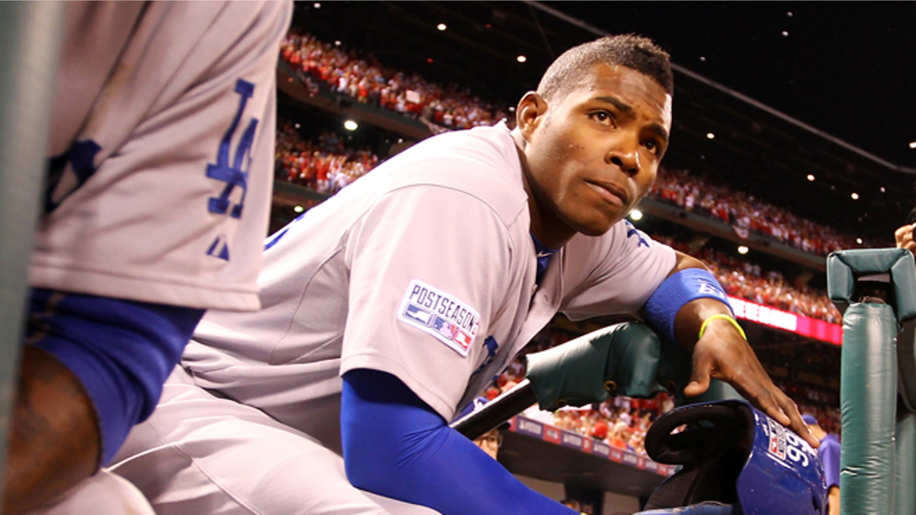 ST LOUIS, MO - OCTOBER 07: Yasiel Puig #66 of the Los Angeles Dodgers looks on from the dugout steps after being defeated by the St. Louis Cardinals in Game Four of the National League Divison Series at Busch Stadium on October 7, 2014 in St Louis, Missouri. (Photo by Jamie Squire/Getty Images)