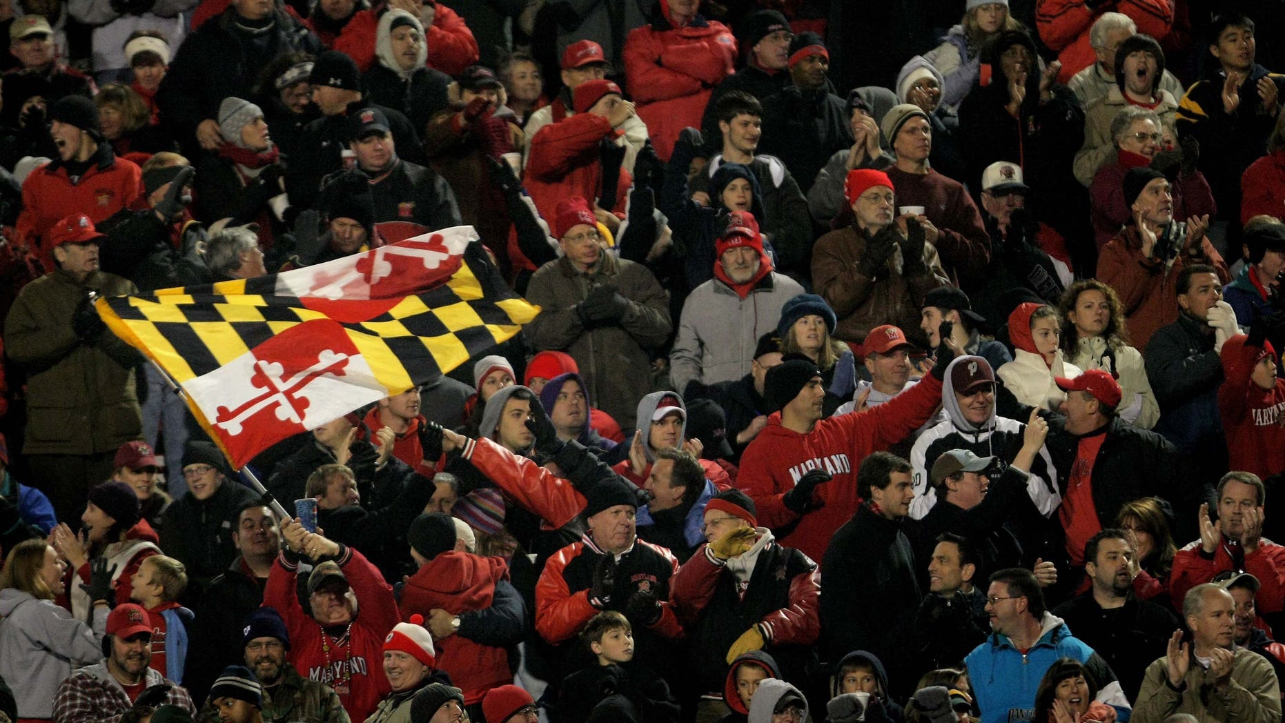 COLLEGE PARK, MD - NOVEMBER 10: A Maryland fan waves the state flag as the Boston College Eagles square off against the Maryland Terrapins at Byrd Stadium on November 10, 2007 in College Park, Maryland. (Photo by Doug Pensinger/Getty Images)